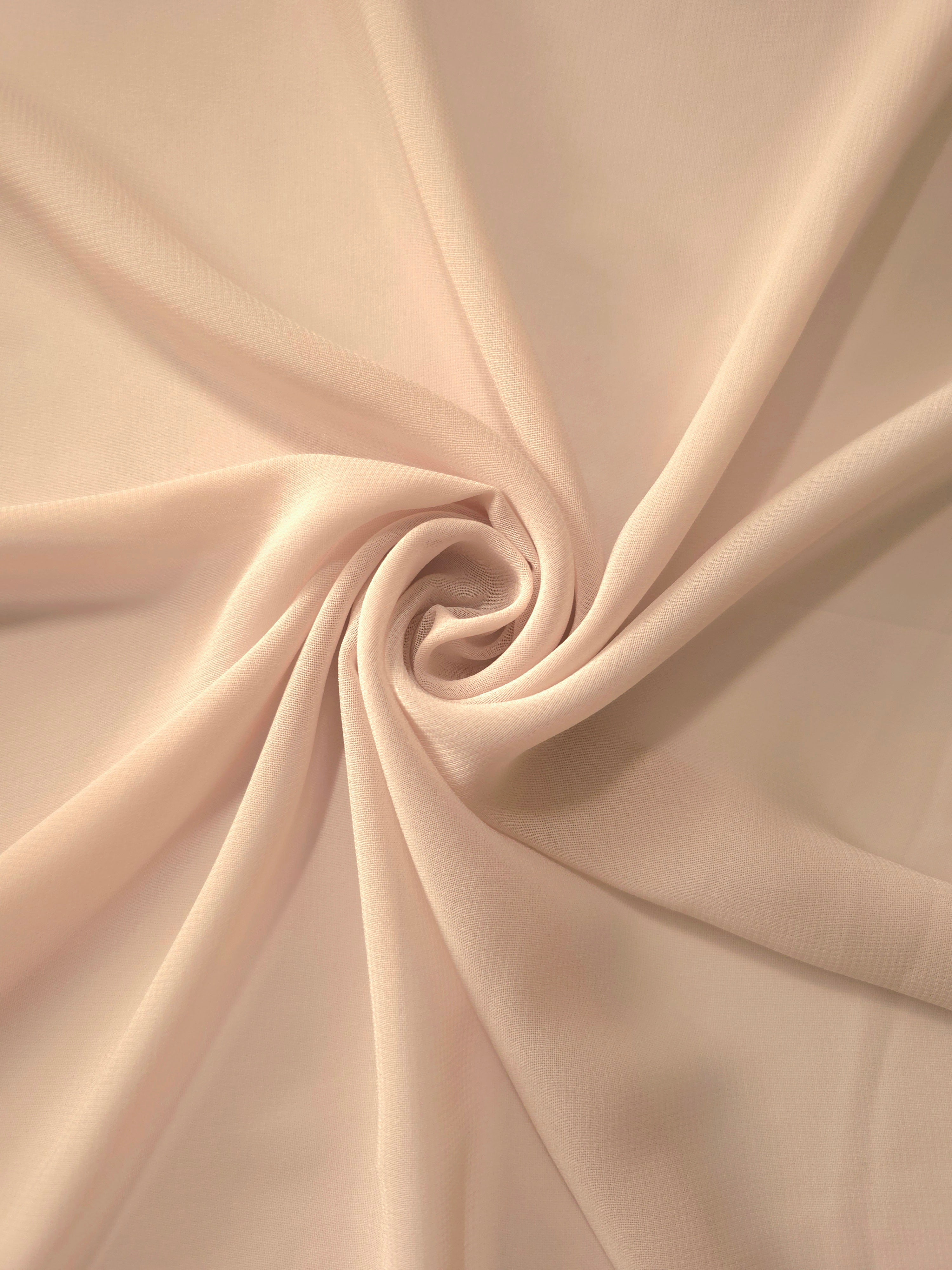 Circular drape of Nude Almond stretch chiffon highlights graceful flow for shawls, gathered dress panels and elegant neutral accents.