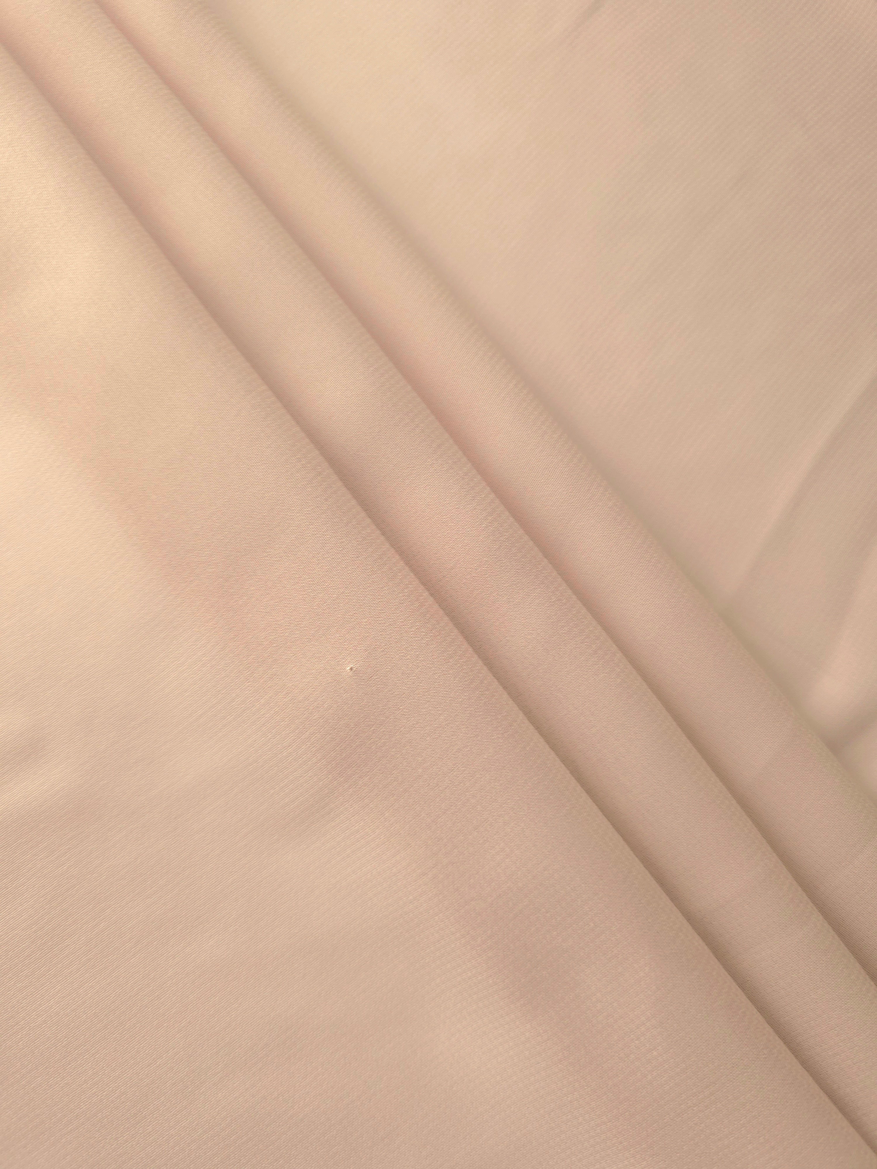 Layered Nude Almond chiffon stretch fabric displays soft depth and flowing structure for tiered skirts, capelets and understated formal layers.