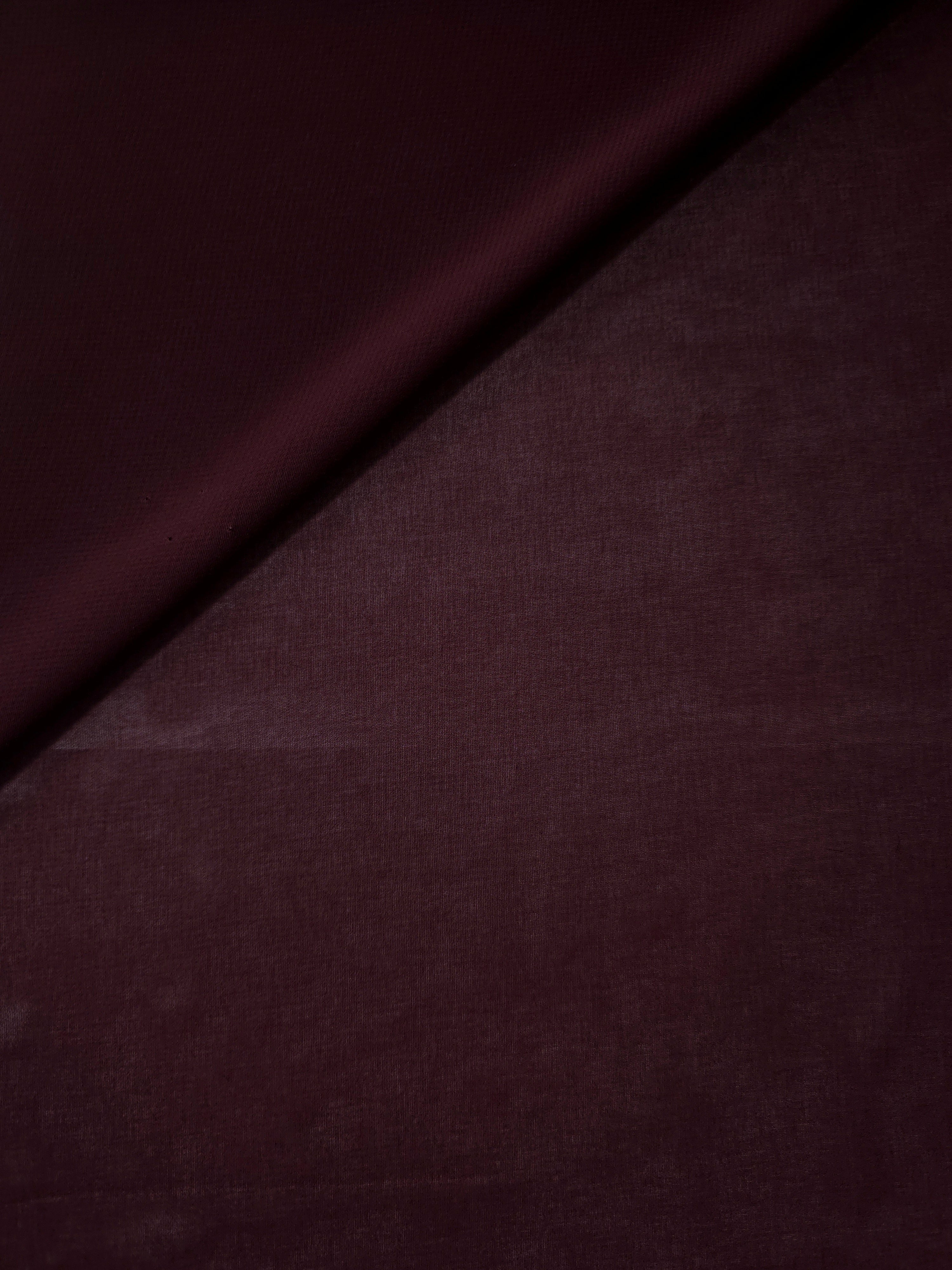 Gentle fold of Oxblood Burgundy stretch chiffon showing its supple fall and airy body for prom dresses, draped tops and lightweight evening wraps.