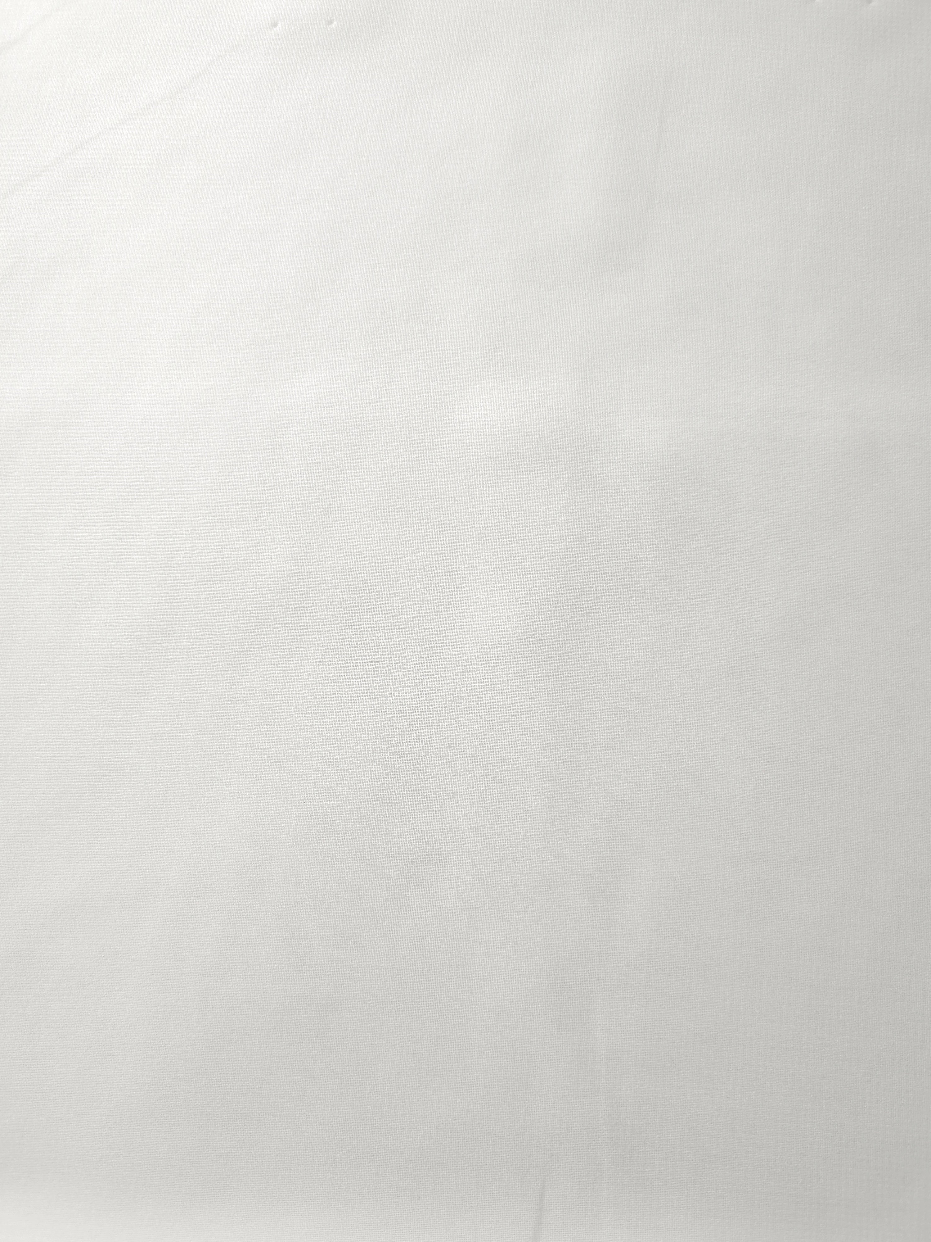 Pearl Ivory silky stretch chiffon shown flat, highlighting its lightweight sheer surface for bridal overlays, veils and soft blouse panels.