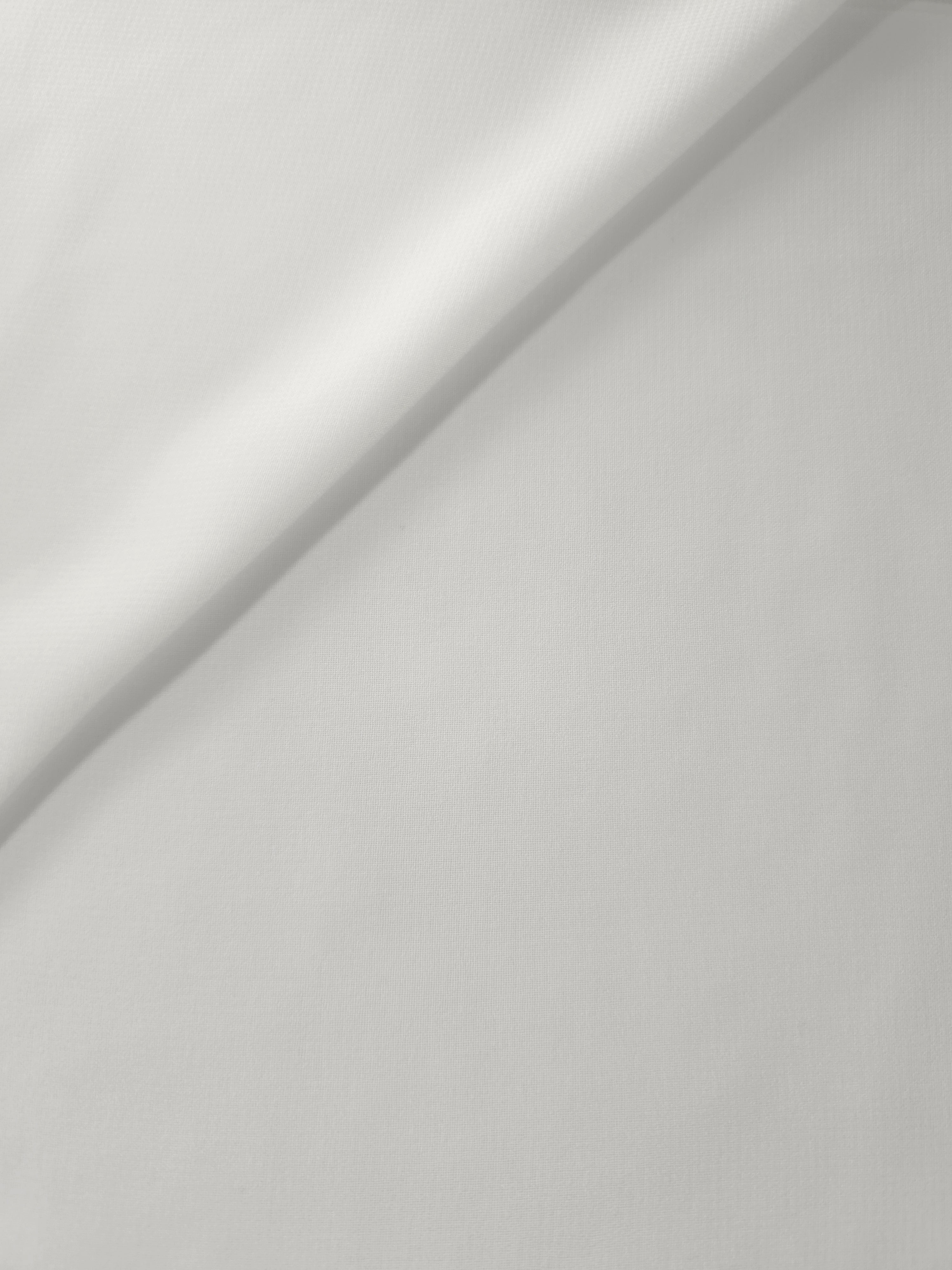 Pearl Ivory stretch chiffon in a soft fold, showing fluid drape and light movement for bridesmaid dresses, scarves and romantic layered tops.