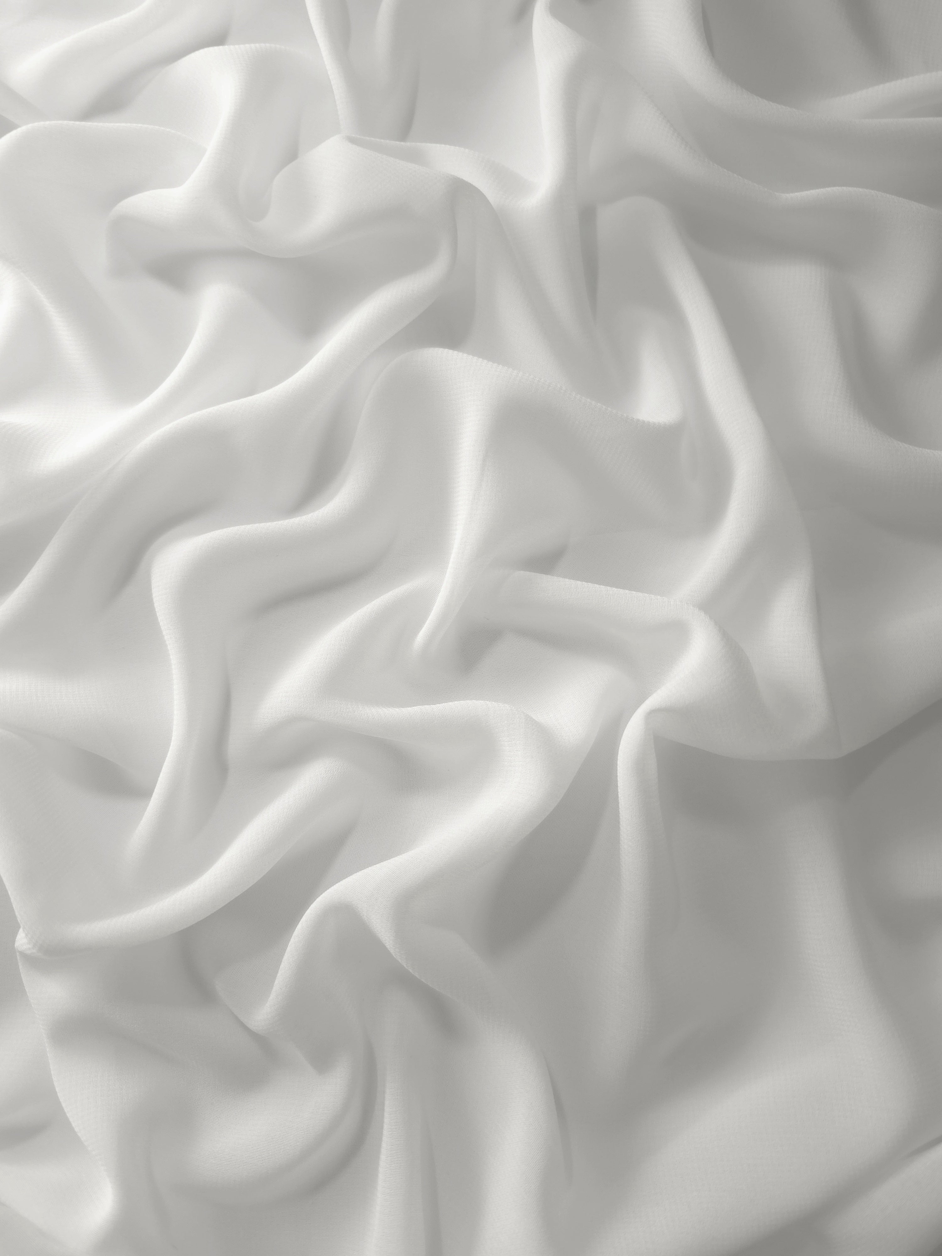 Draped Pearl Ivory silky stretch chiffon with flowing folds, ideal for wedding gowns, capelets and elegant occasionwear overlays.