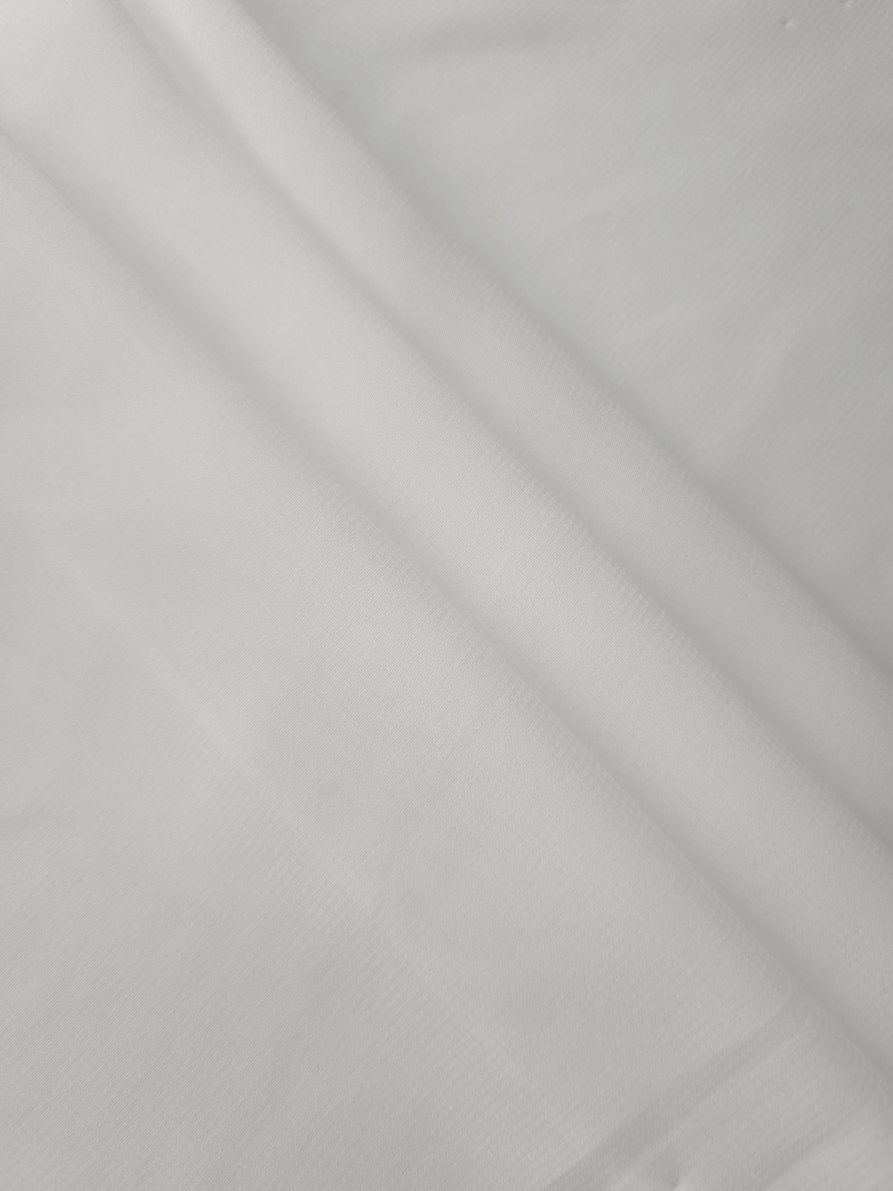 Layered folds of Pearl Ivory stretch chiffon show depth and translucency for tiered skirts, bridal accents and lined formal dresses.