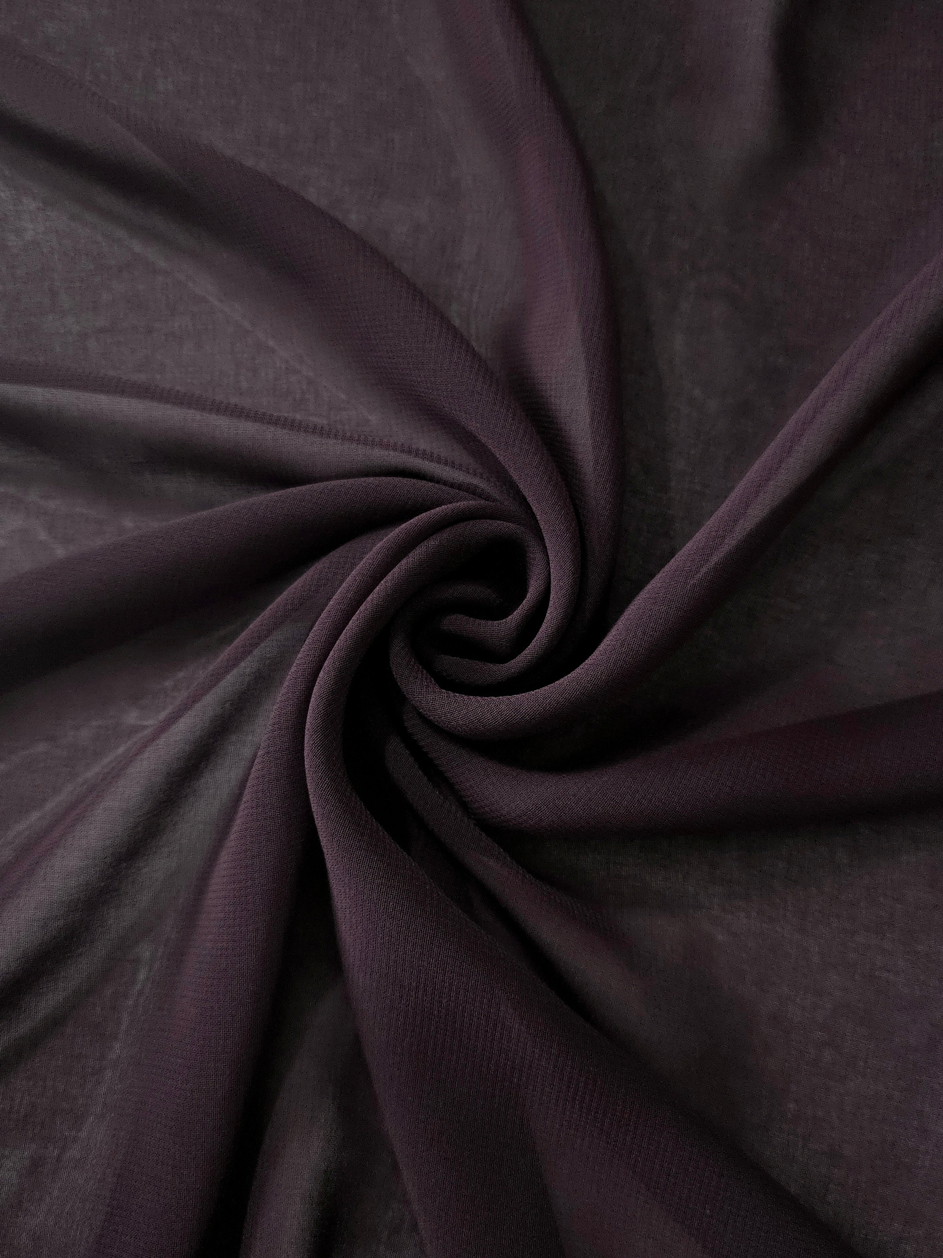 Smoky Plum stretch chiffon arranged in a swirl, emphasizing airy movement for shawls, gathered dress accents and soft wrap details.