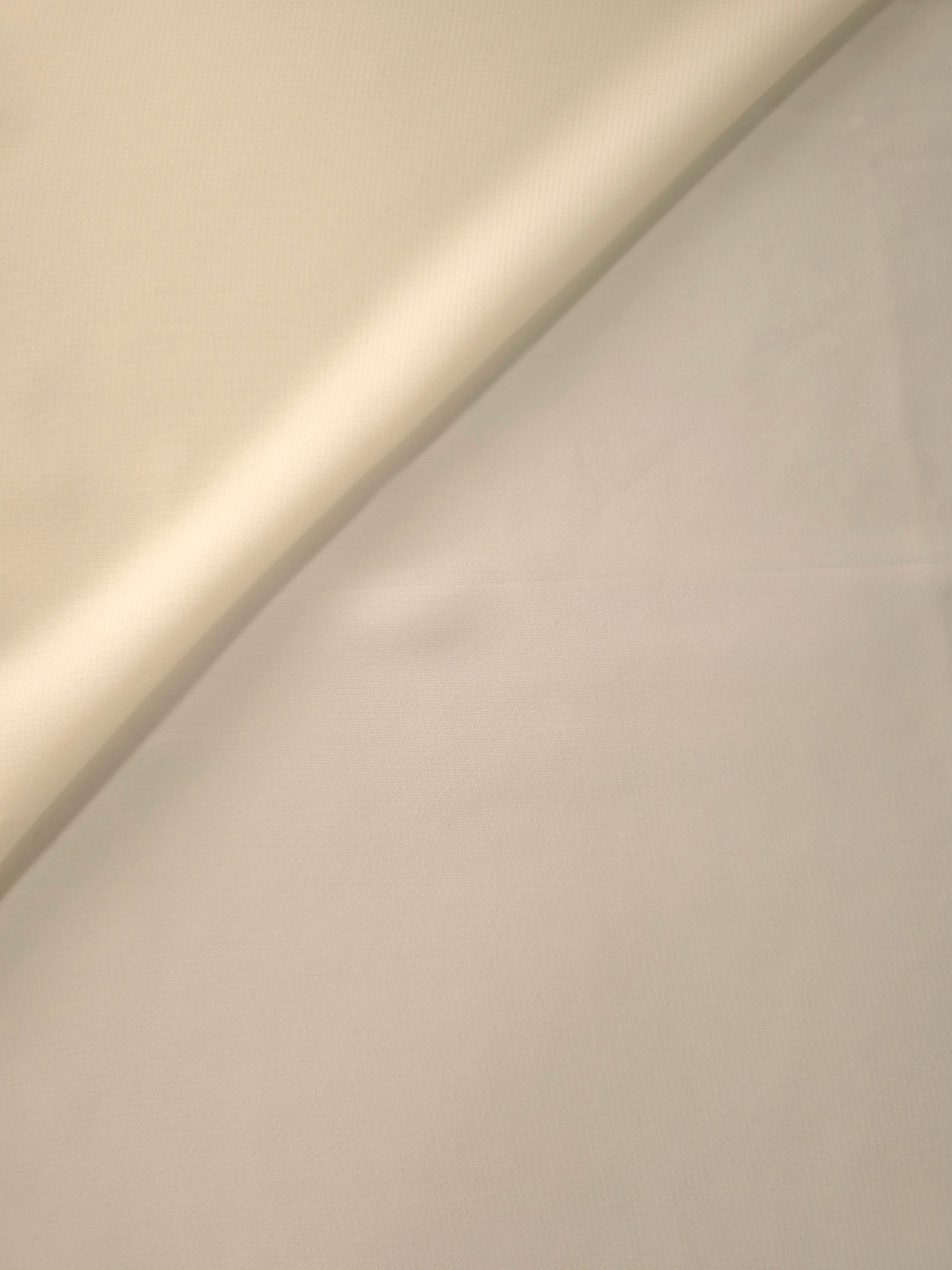 Gentle fold of Warm Sand Beige stretch chiffon showing its supple fall and airy body for soft dresses, draped tops and lightweight shoulder wraps.