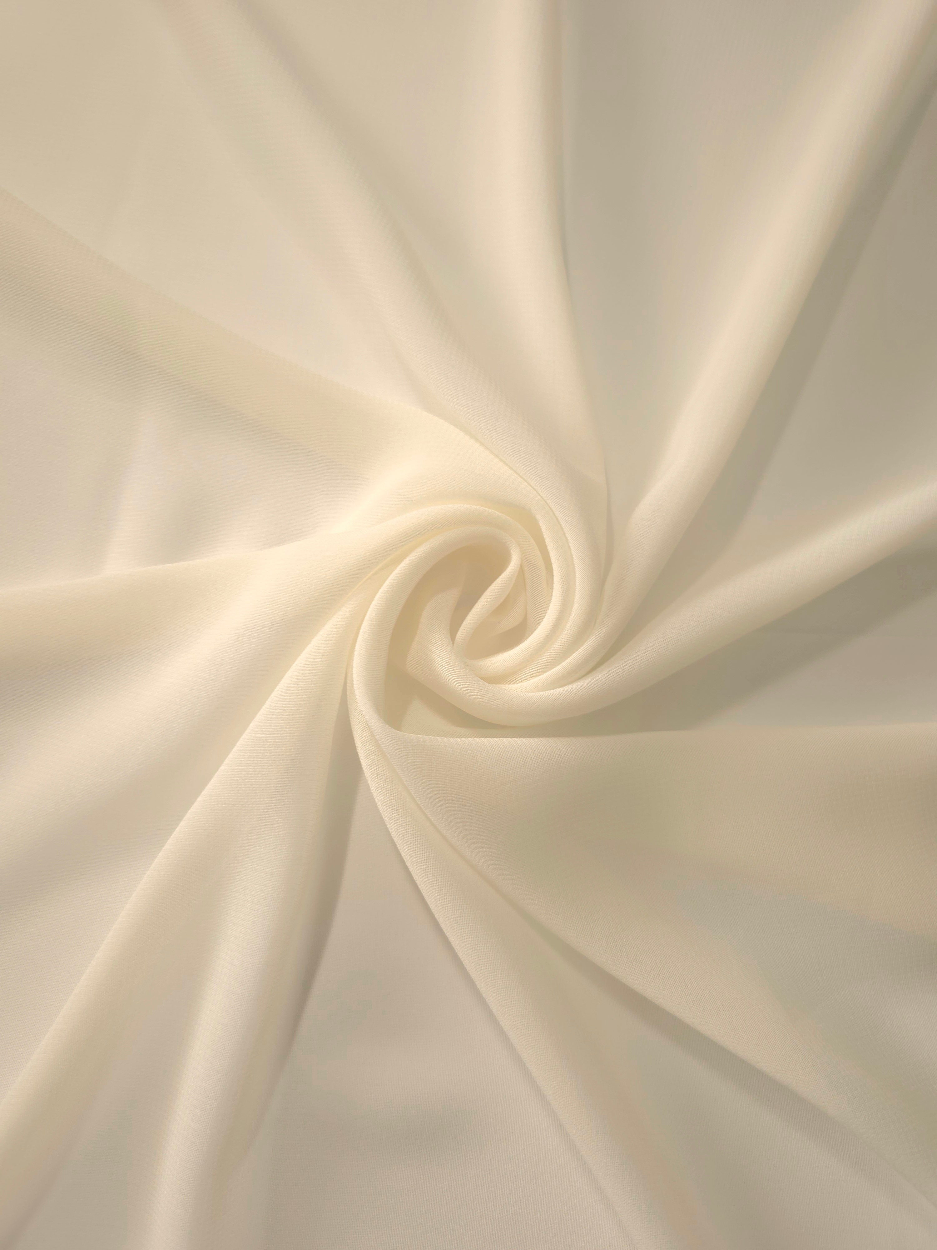 Circular drape of Warm Sand Beige stretch chiffon highlights graceful flow for shawls, sash details and gathered warm-weather garments.