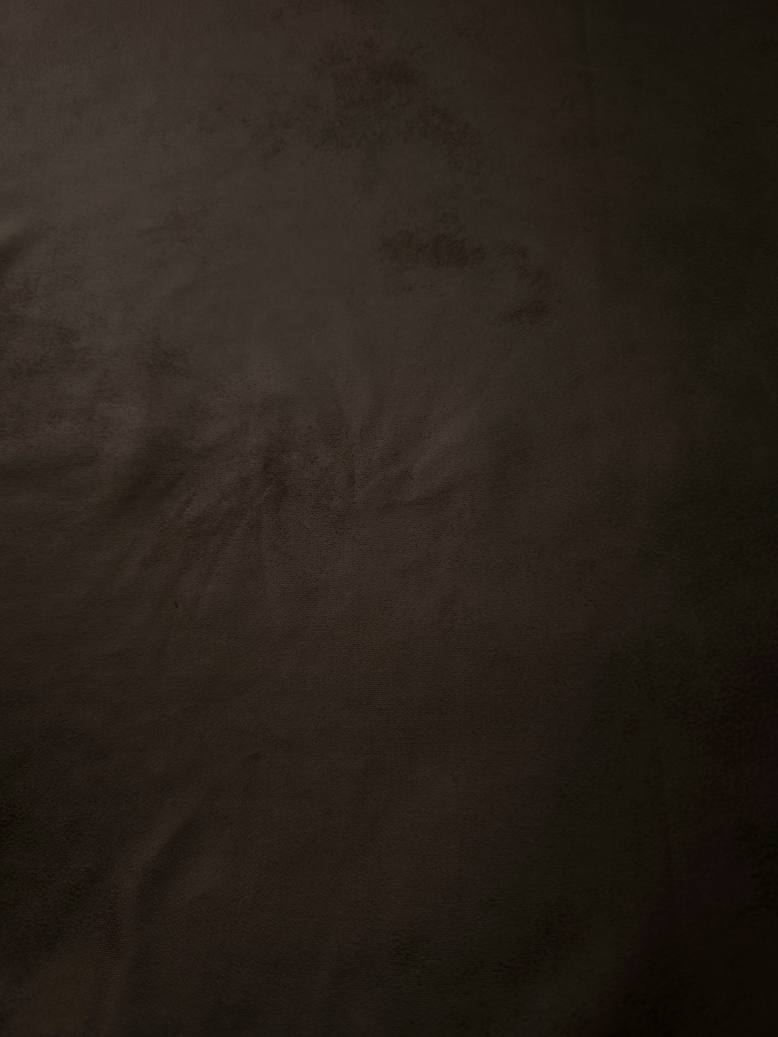 Close-up of deep espresso brown leather-effect stretch fabric revealing smooth texture for corsetry, dress panels and modern apparel.