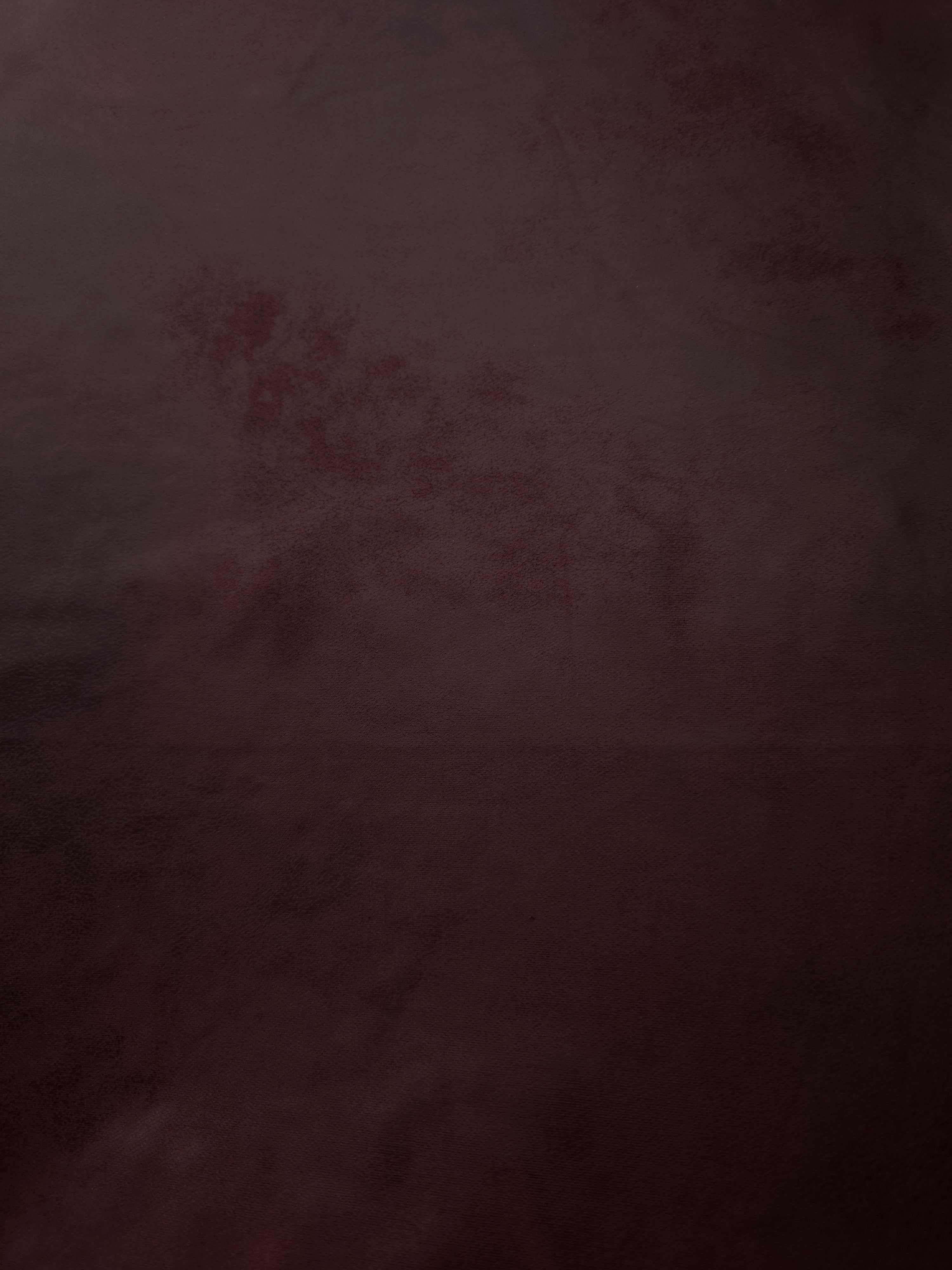 Close texture view of deep plum soft faux leather stretch fabric with sleek leather effect for corset tops, skirts and evening separates.