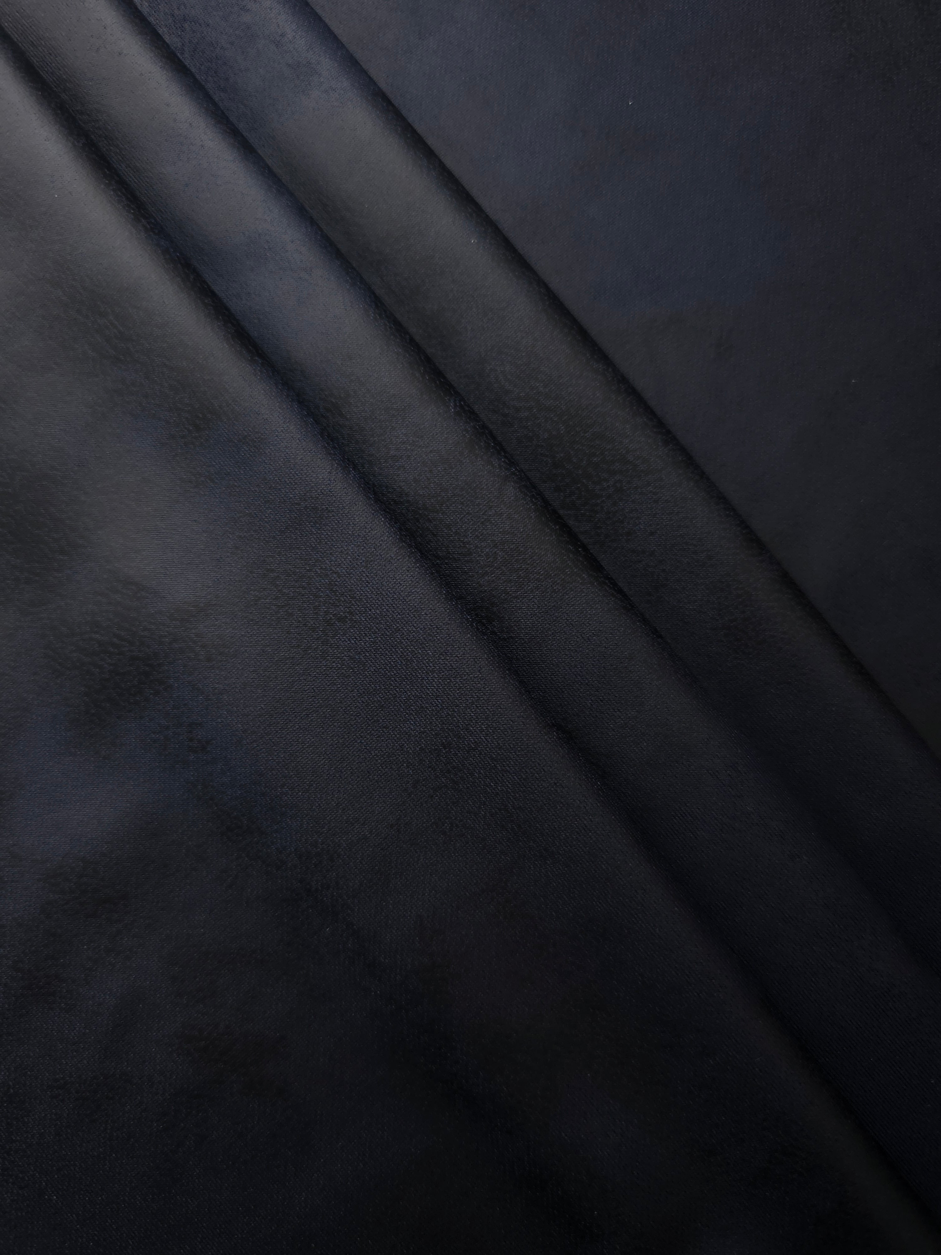 Layered midnight navy faux leather stretch fabric reveals soft body and movement for slim trousers, skirts and fashion separates.