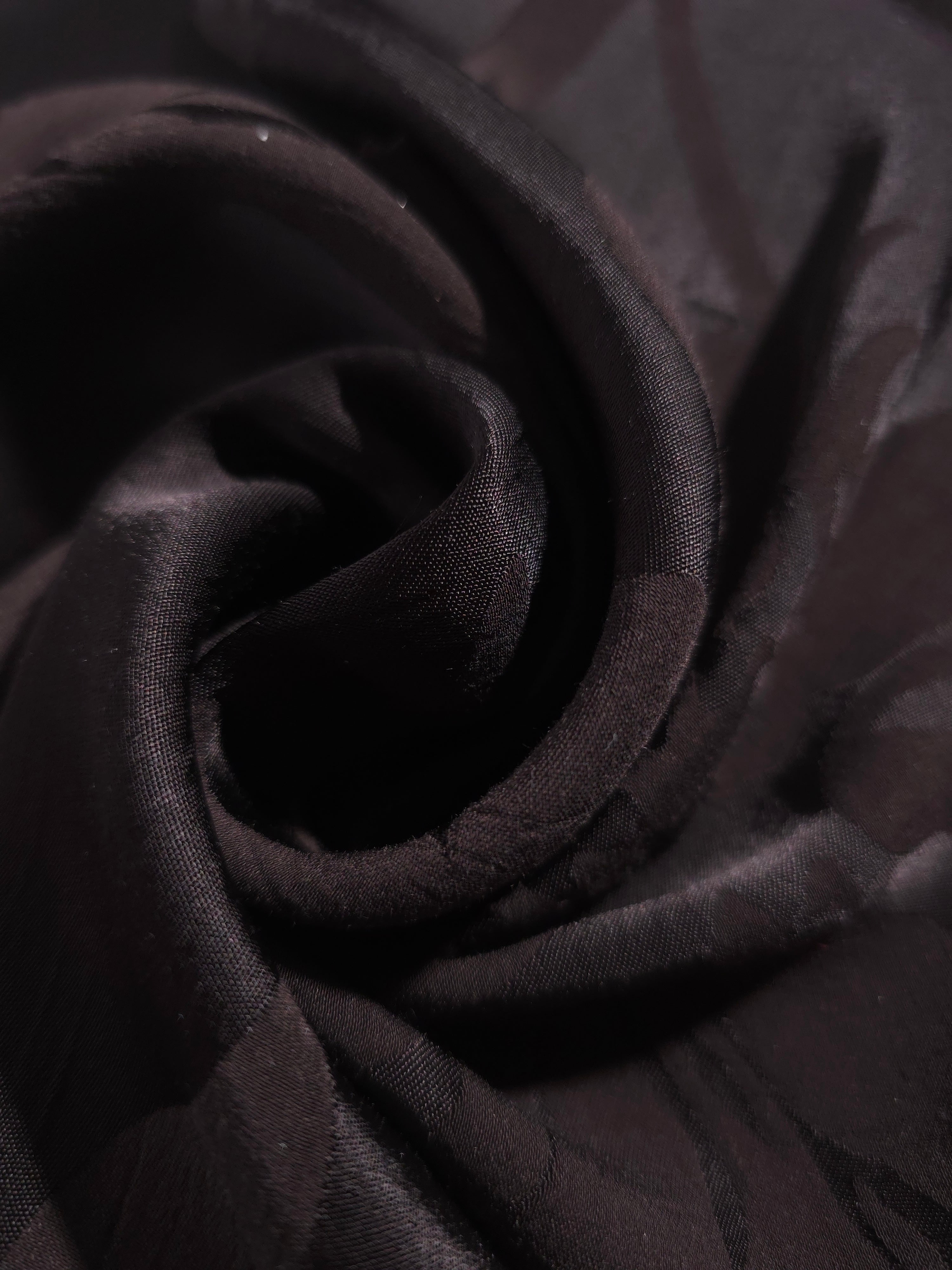 Close-up of draped Big Flower tonal jacquard fabric showing silky texture and fold detail