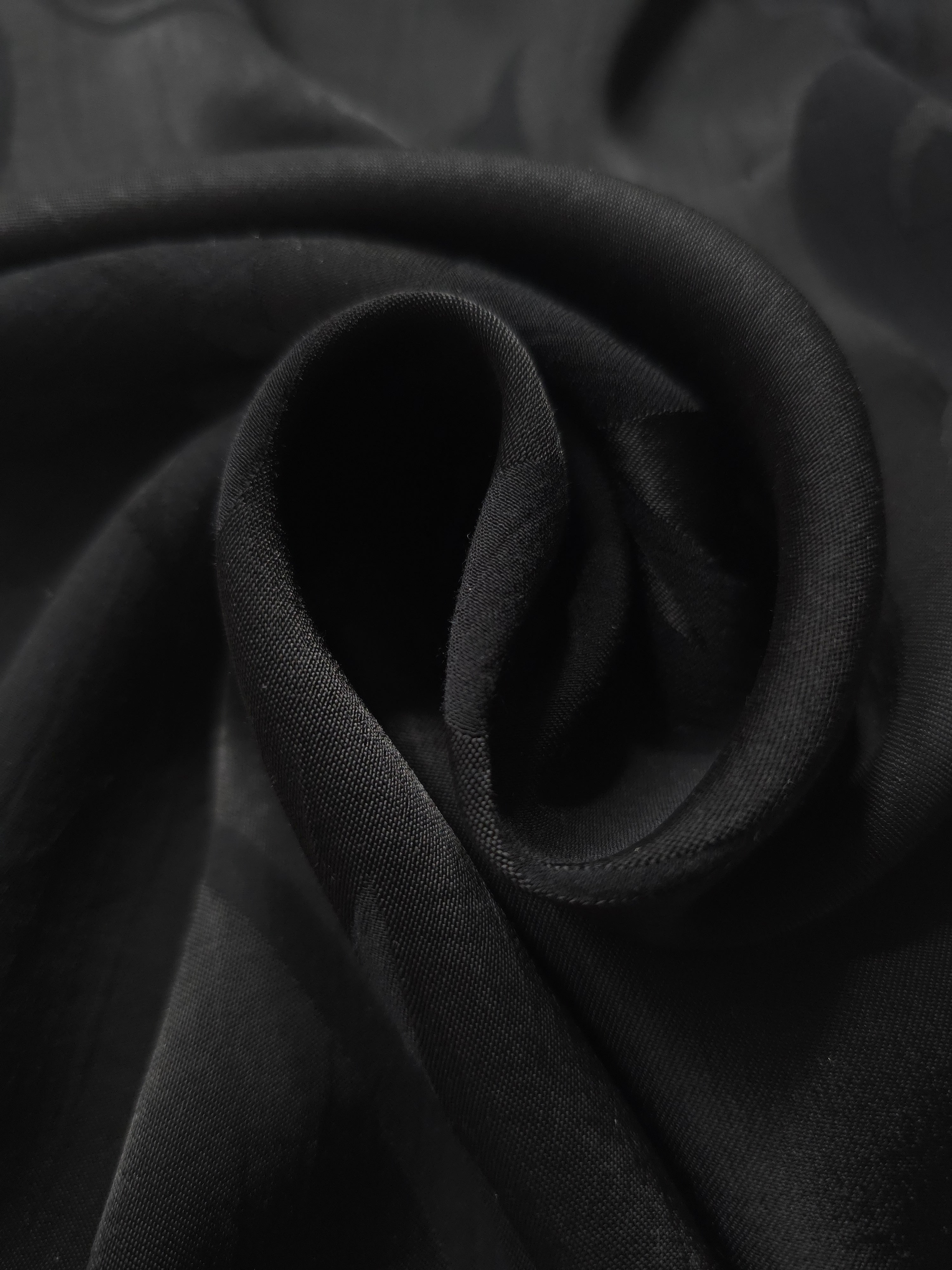 Close-up of draped Big Flower tonal jacquard fabric showing silky texture and fold detail