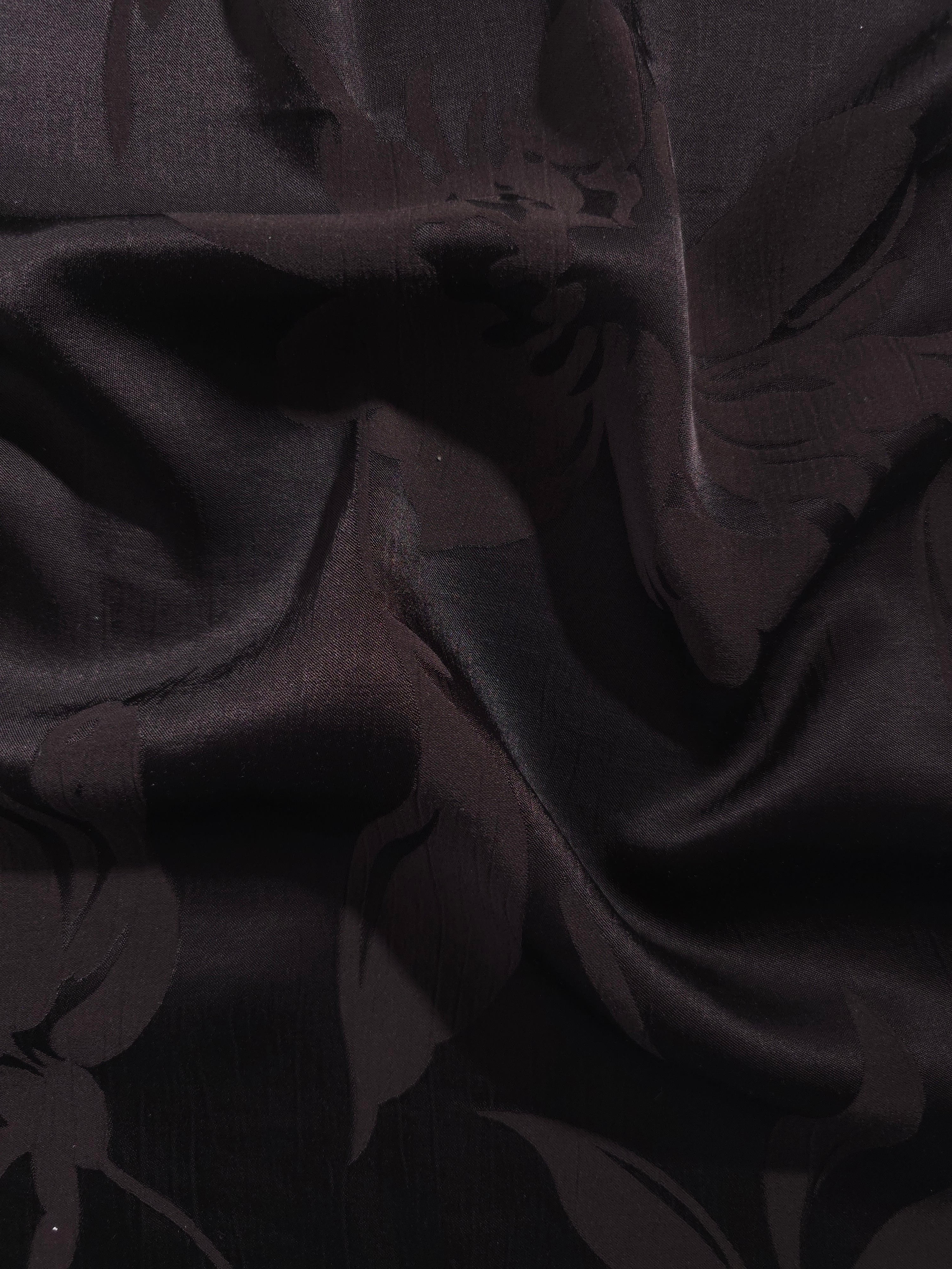 Big Flower tonal viscose jacquard fabric in a wave fold, showing silky sheen