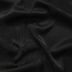 Big Flower tonal viscose jacquard fabric in a wave fold, showing silky sheen
