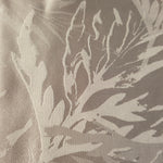 Close-up of Branch self-jacquard motif on silky tonal viscose fabric