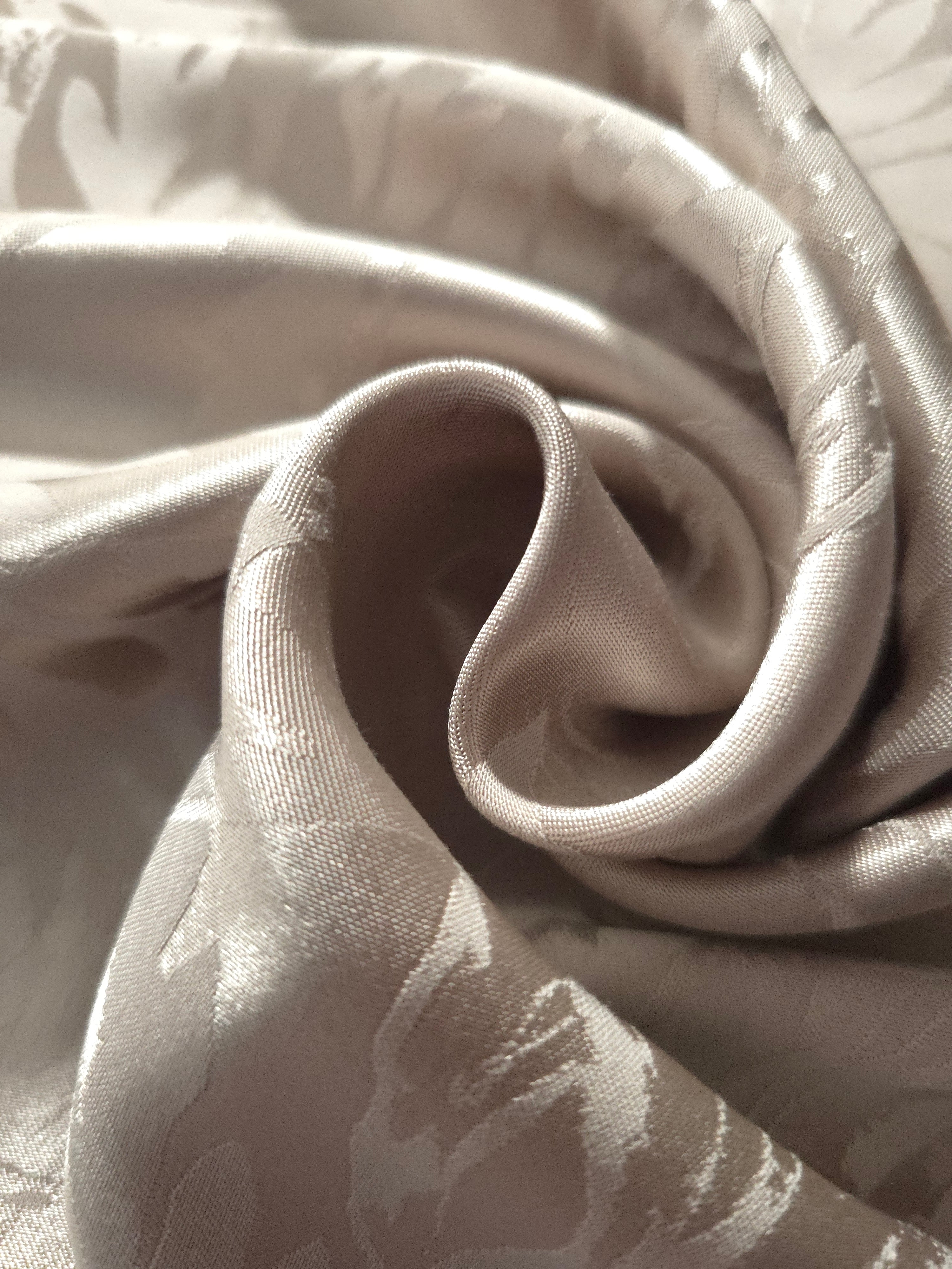 Close-up of draped Branch tonal jacquard fabric showing silky texture and fold detail