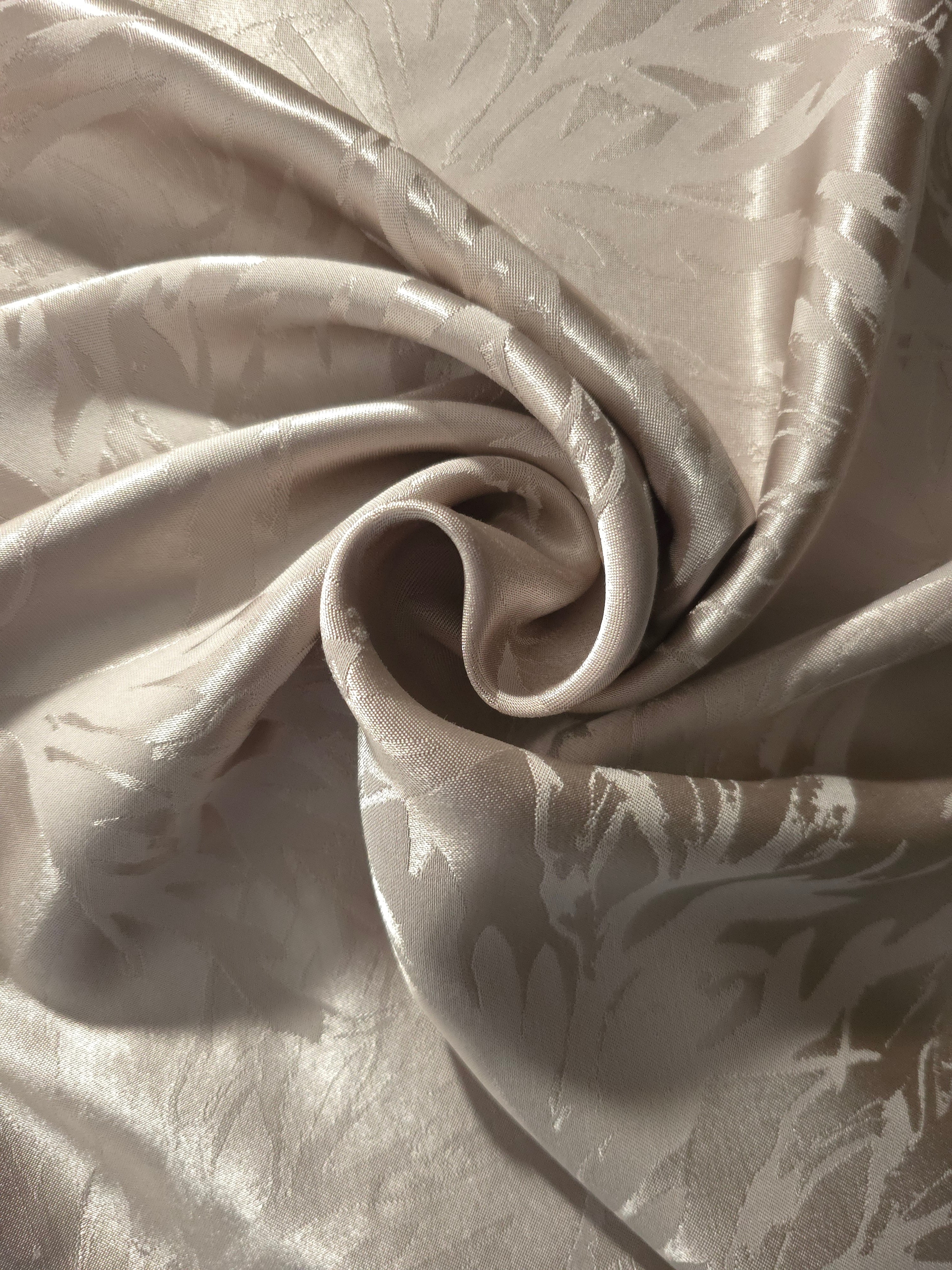 Branch self-jacquard tonal viscose fabric draped, showing silky fluid movement