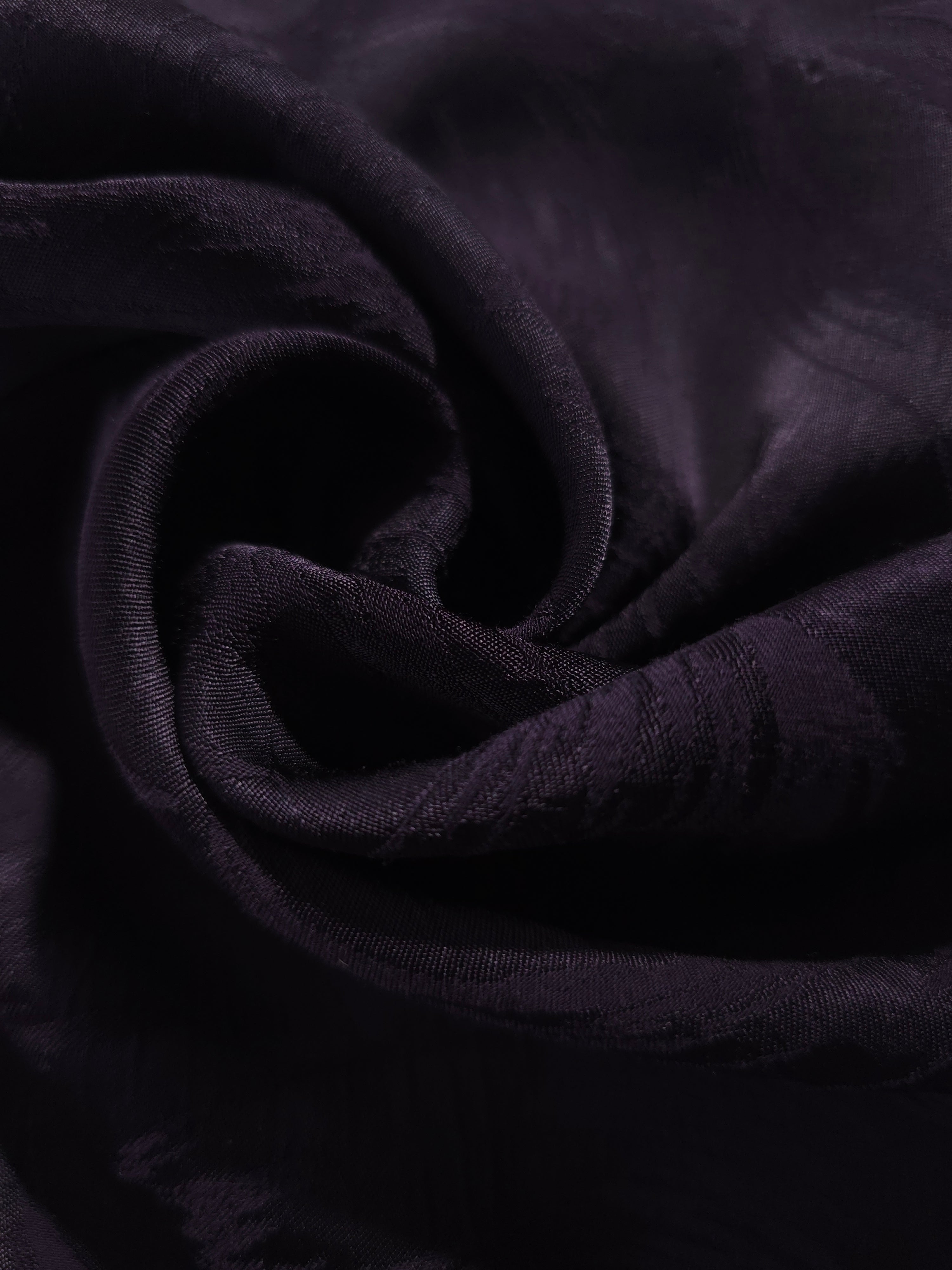 Close-up of draped Brush tonal jacquard fabric showing silky texture and fold detail