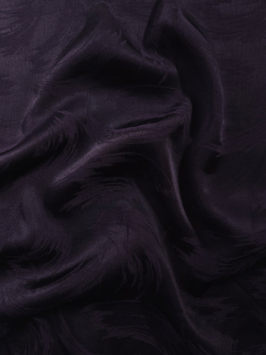 Brush tonal viscose jacquard fabric in a wave fold, showing silky sheen