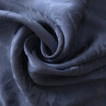 Daisy self-jacquard tonal viscose fabric draped, showing silky fluid movement