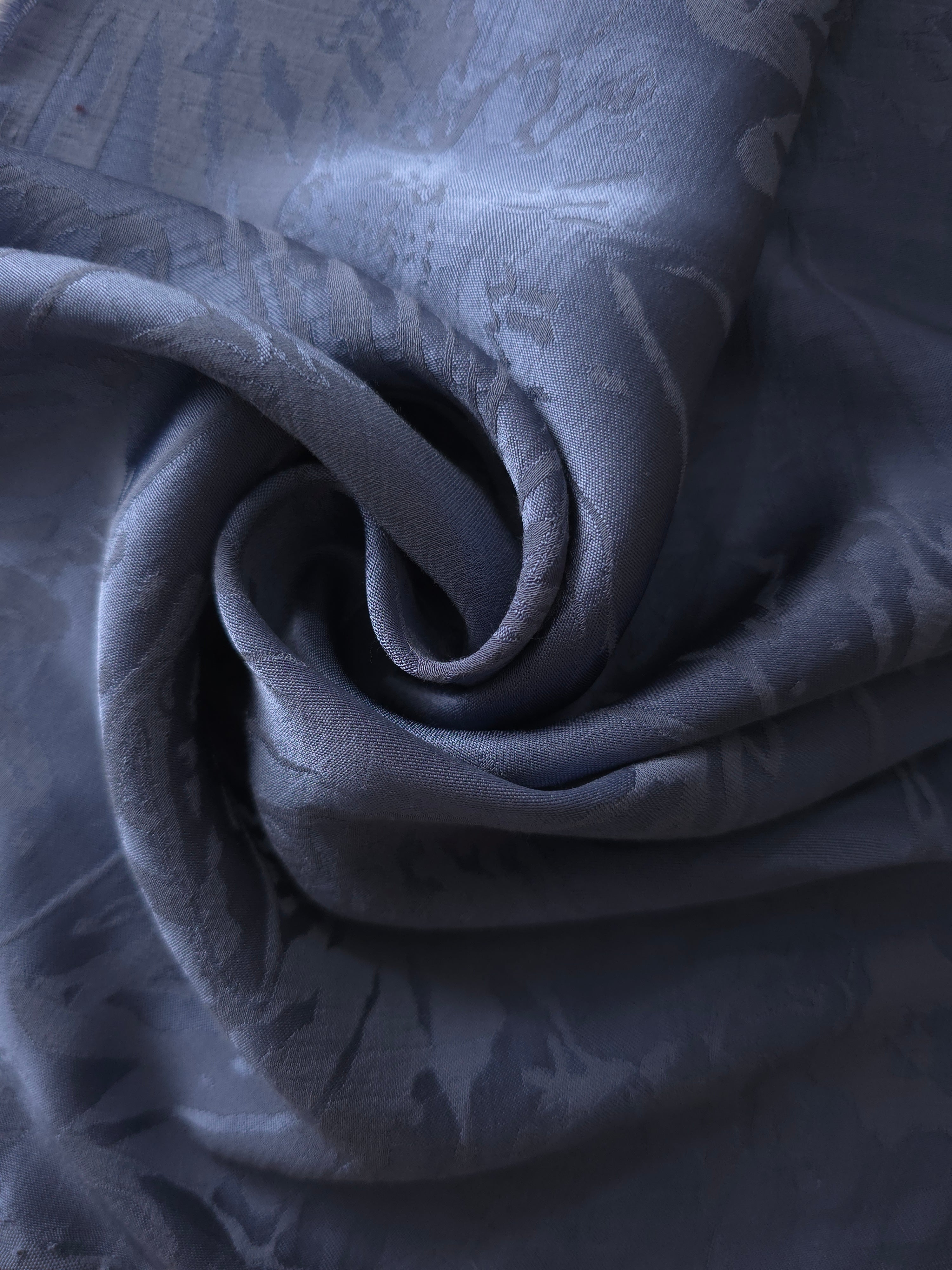 Daisy self-jacquard tonal viscose fabric draped, showing silky fluid movement