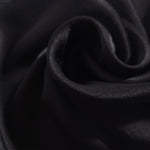 Close-up of draped Flat tonal jacquard fabric showing silky texture and fold detail