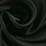 Close-up of draped Flat tonal jacquard fabric showing silky texture and fold detail