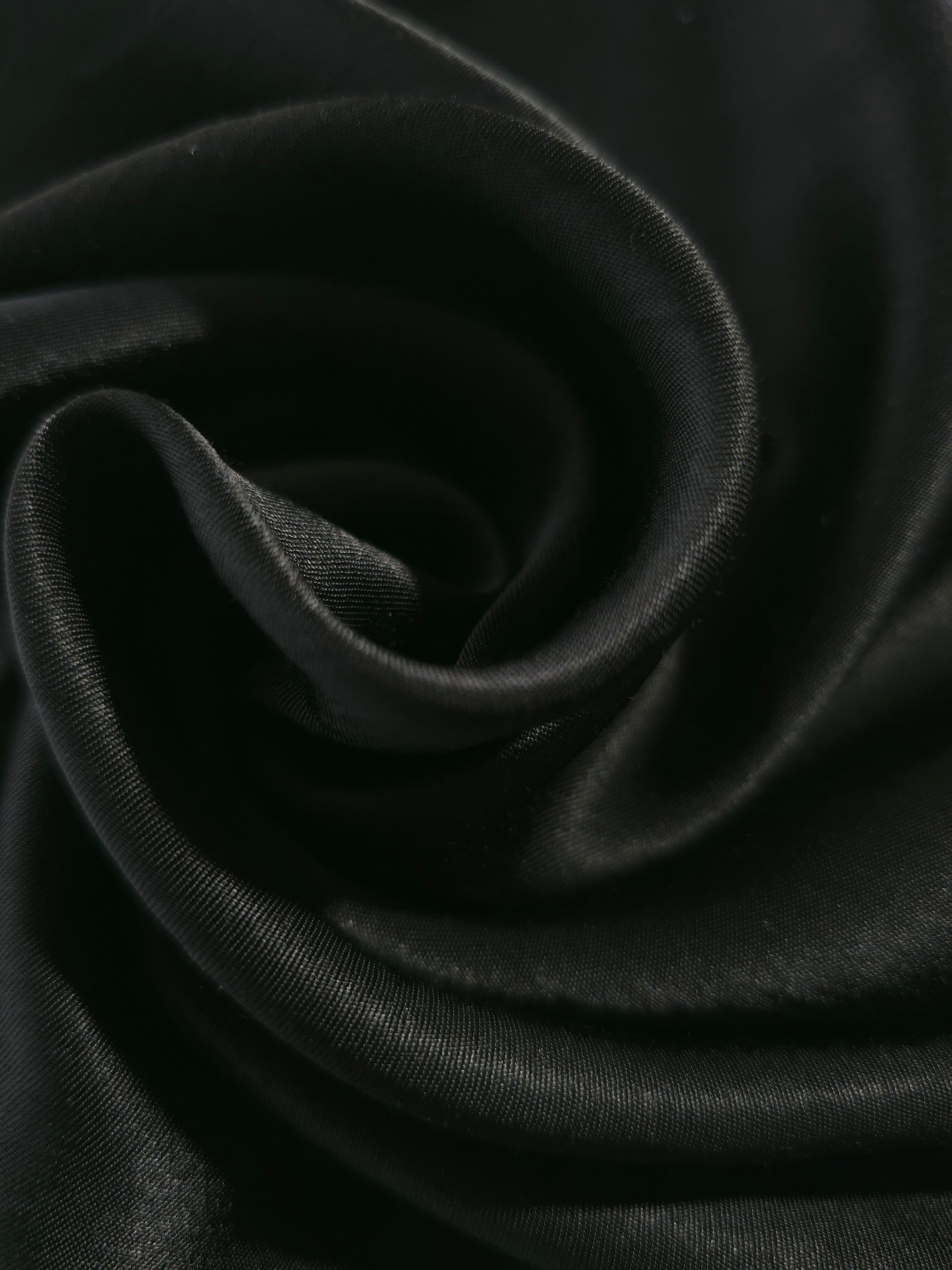 Close-up of draped Flat tonal jacquard fabric showing silky texture and fold detail