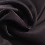 Close-up of draped Flat tonal jacquard fabric showing silky texture and fold detail