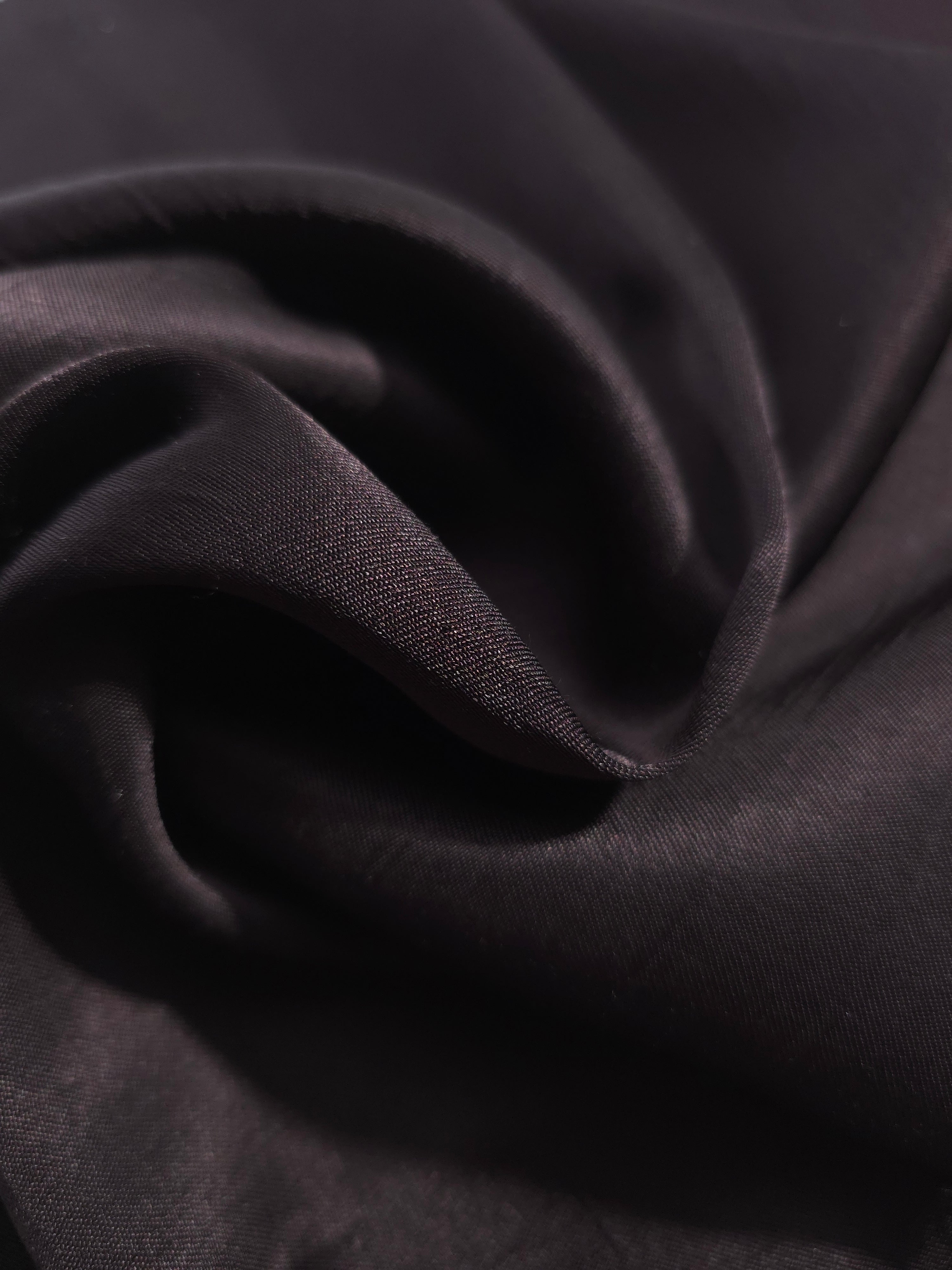 Close-up of draped Flat tonal jacquard fabric showing silky texture and fold detail