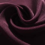 Close-up of draped Flat tonal jacquard fabric showing silky texture and fold detail