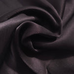 Flat self-jacquard tonal viscose fabric draped, showing silky fluid movement