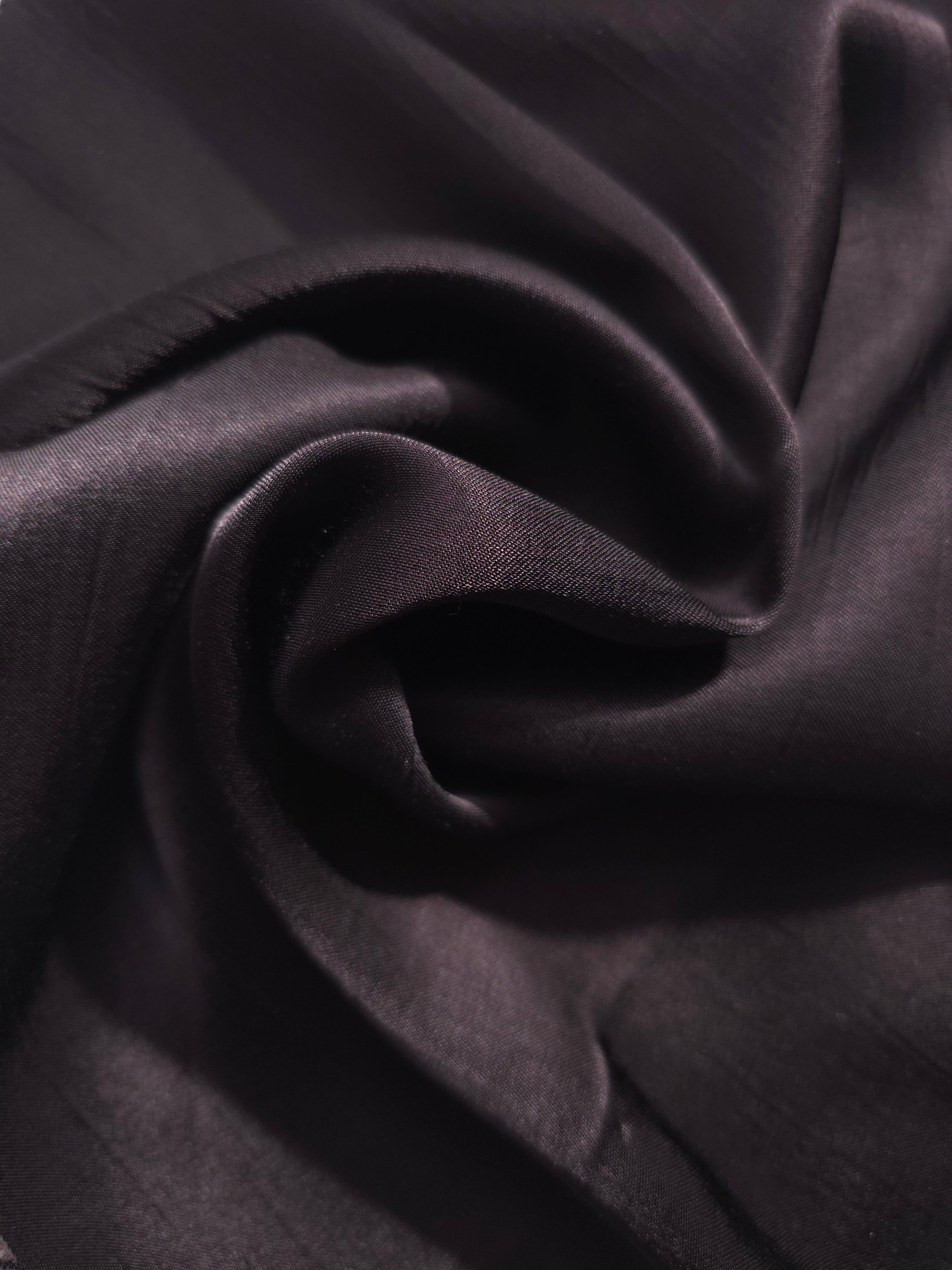 Flat self-jacquard tonal viscose fabric draped, showing silky fluid movement