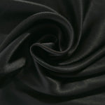 Flat self-jacquard tonal viscose fabric draped, showing silky fluid movement