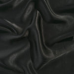 Flat tonal viscose jacquard fabric in a wave fold, showing silky sheen