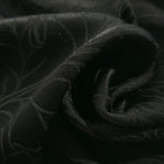 Close-up of draped Floral tonal jacquard fabric showing silky texture and fold detail