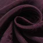Close-up of draped Floral tonal jacquard fabric showing silky texture and fold detail