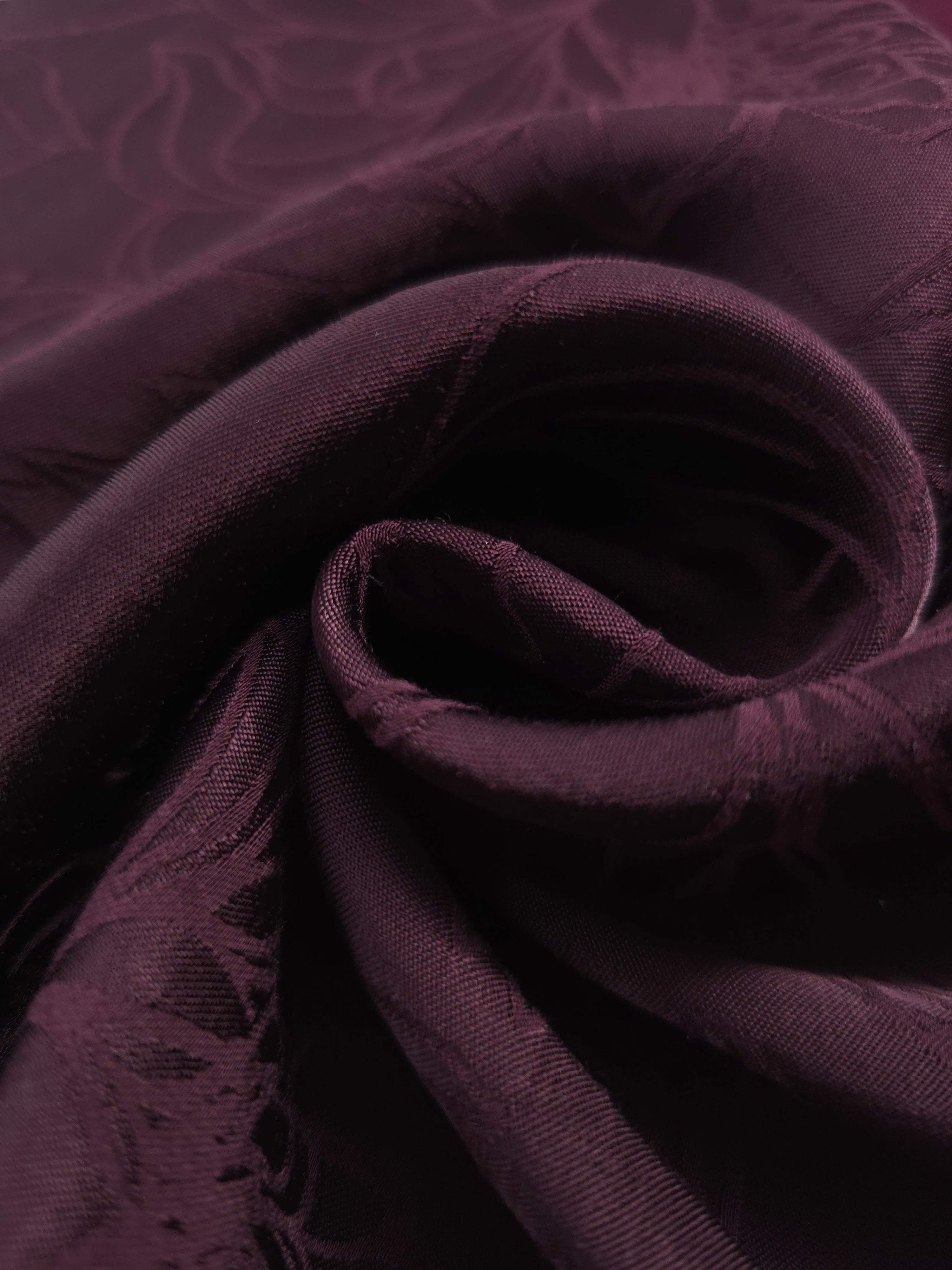 Close-up of draped Floral tonal jacquard fabric showing silky texture and fold detail