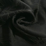 Floral self-jacquard tonal viscose fabric draped, showing silky fluid movement