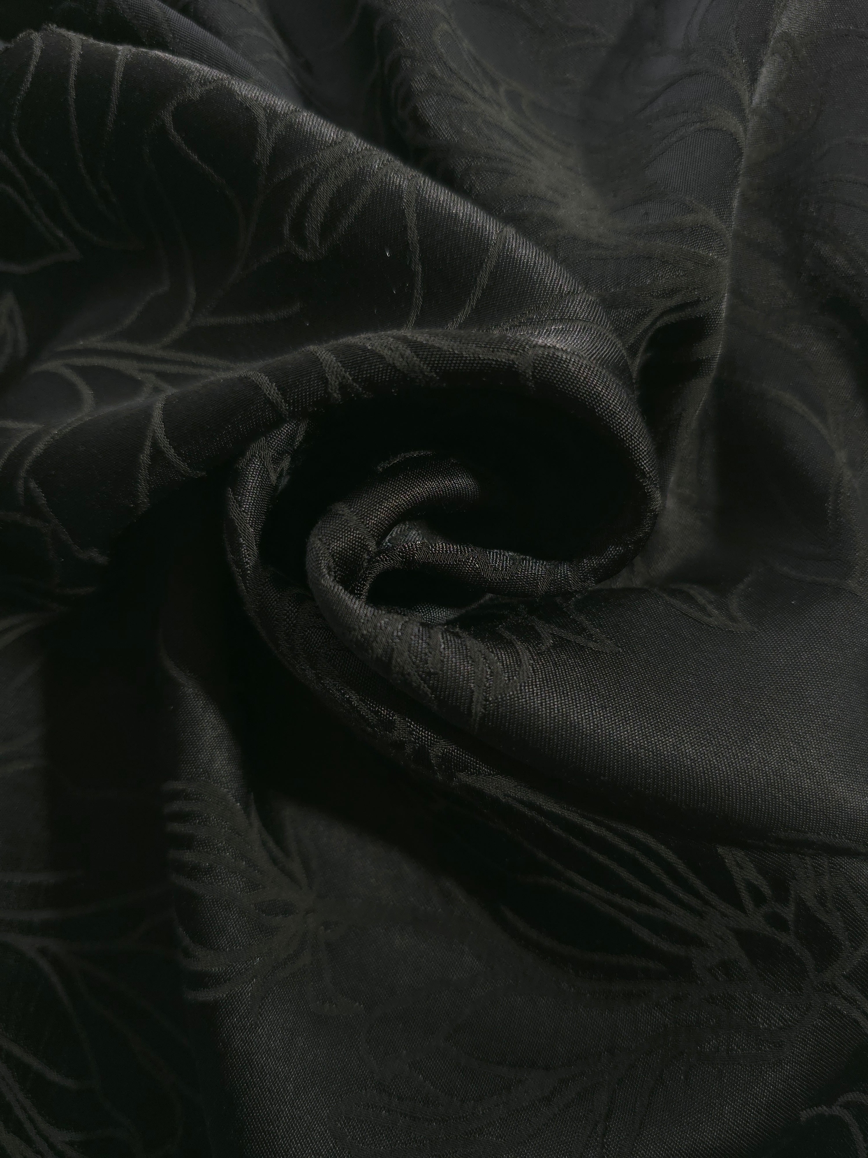 Floral self-jacquard tonal viscose fabric draped, showing silky fluid movement