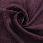 Floral self-jacquard tonal viscose fabric draped, showing silky fluid movement