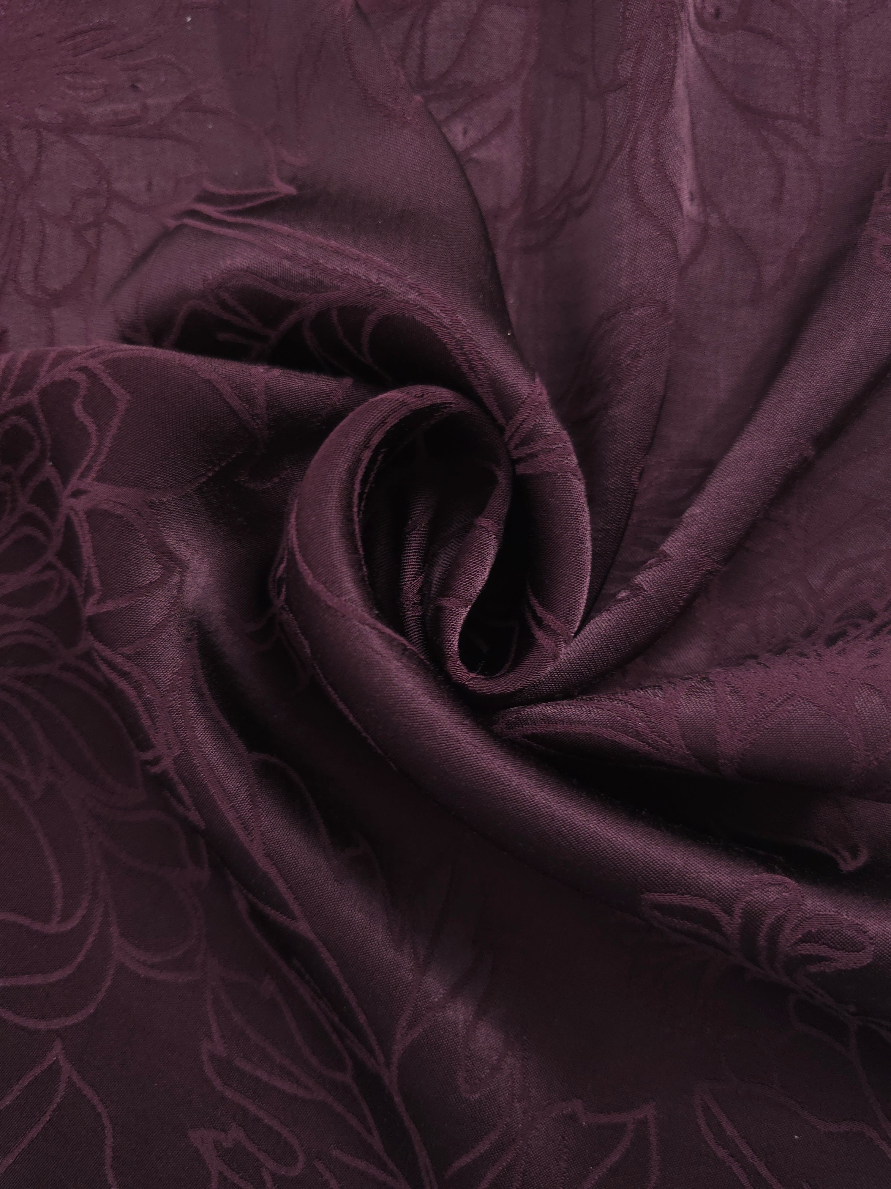 Floral self-jacquard tonal viscose fabric draped, showing silky fluid movement
