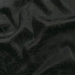 Floral tonal viscose jacquard fabric in a wave fold, showing silky sheen