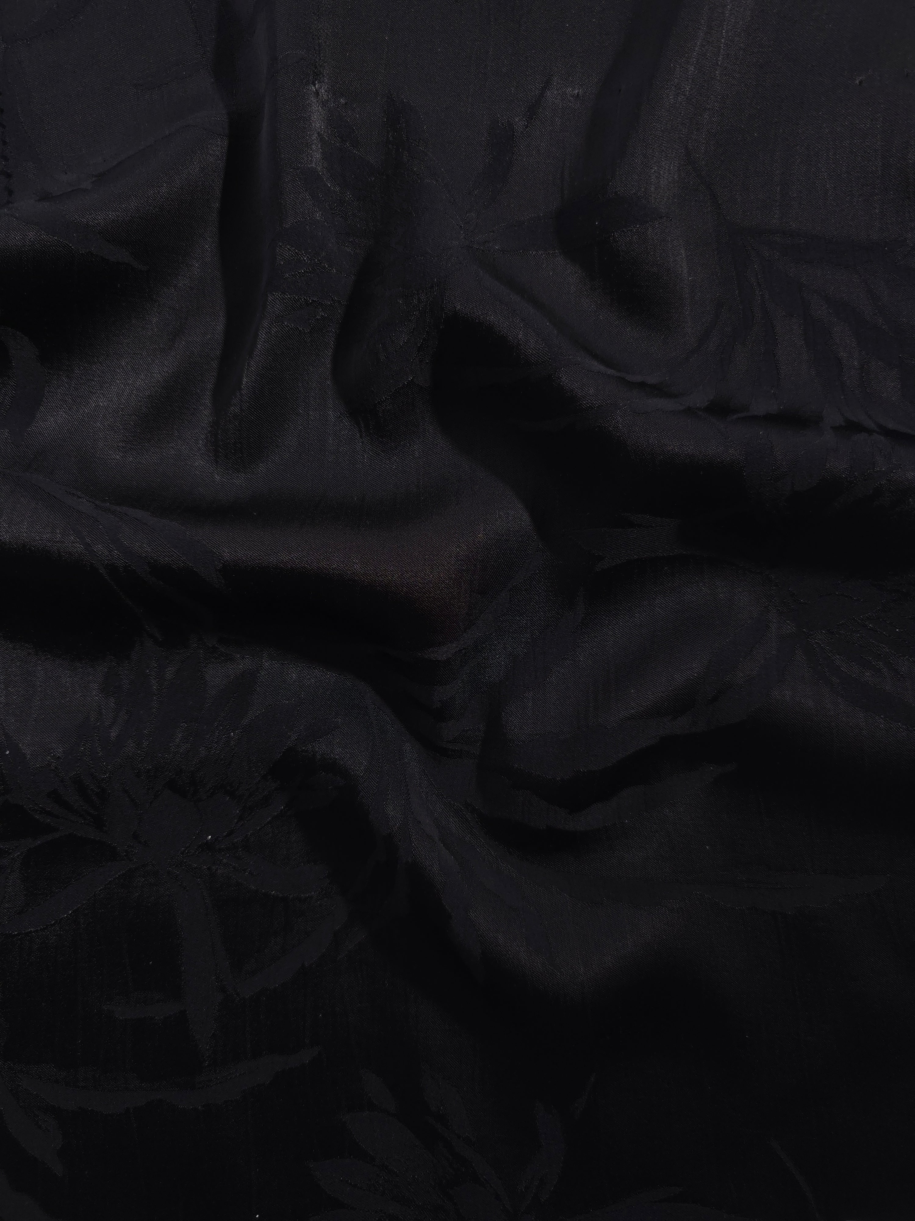 Lily Flower tonal viscose jacquard fabric in a wave fold, showing silky sheen