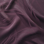 Seaweed tonal viscose jacquard fabric in a wave fold, showing silky sheen