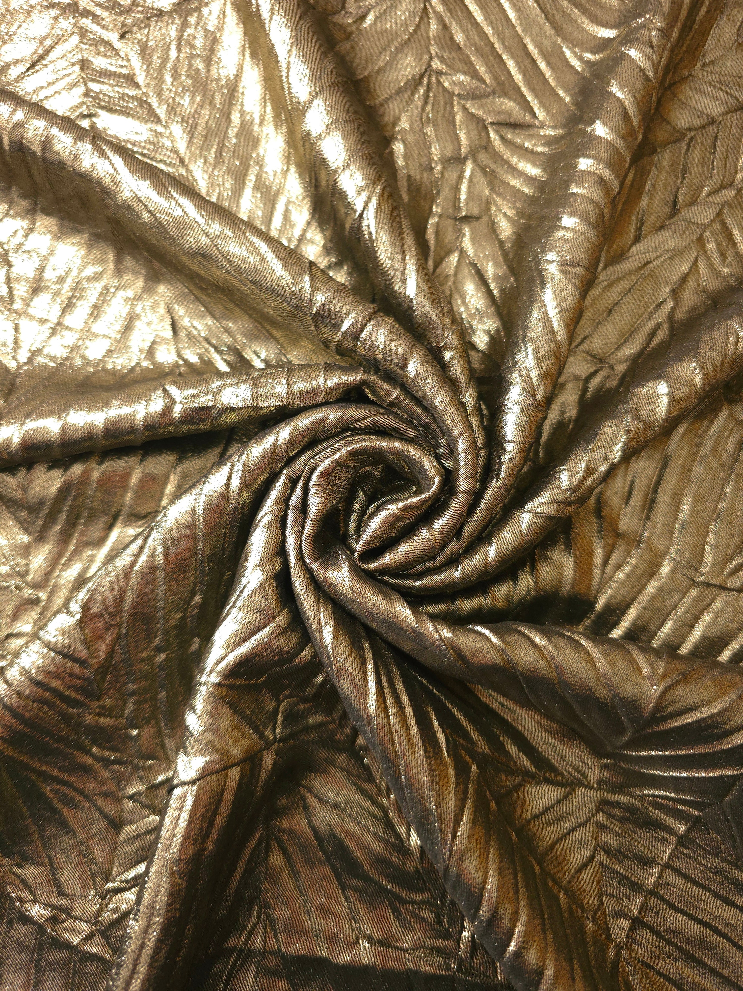 Antique Gold shimmer plissé shown in a broad view, making the pleat pattern and visual rhythm clear for blouses, skirts and fashion-forward layering pieces.