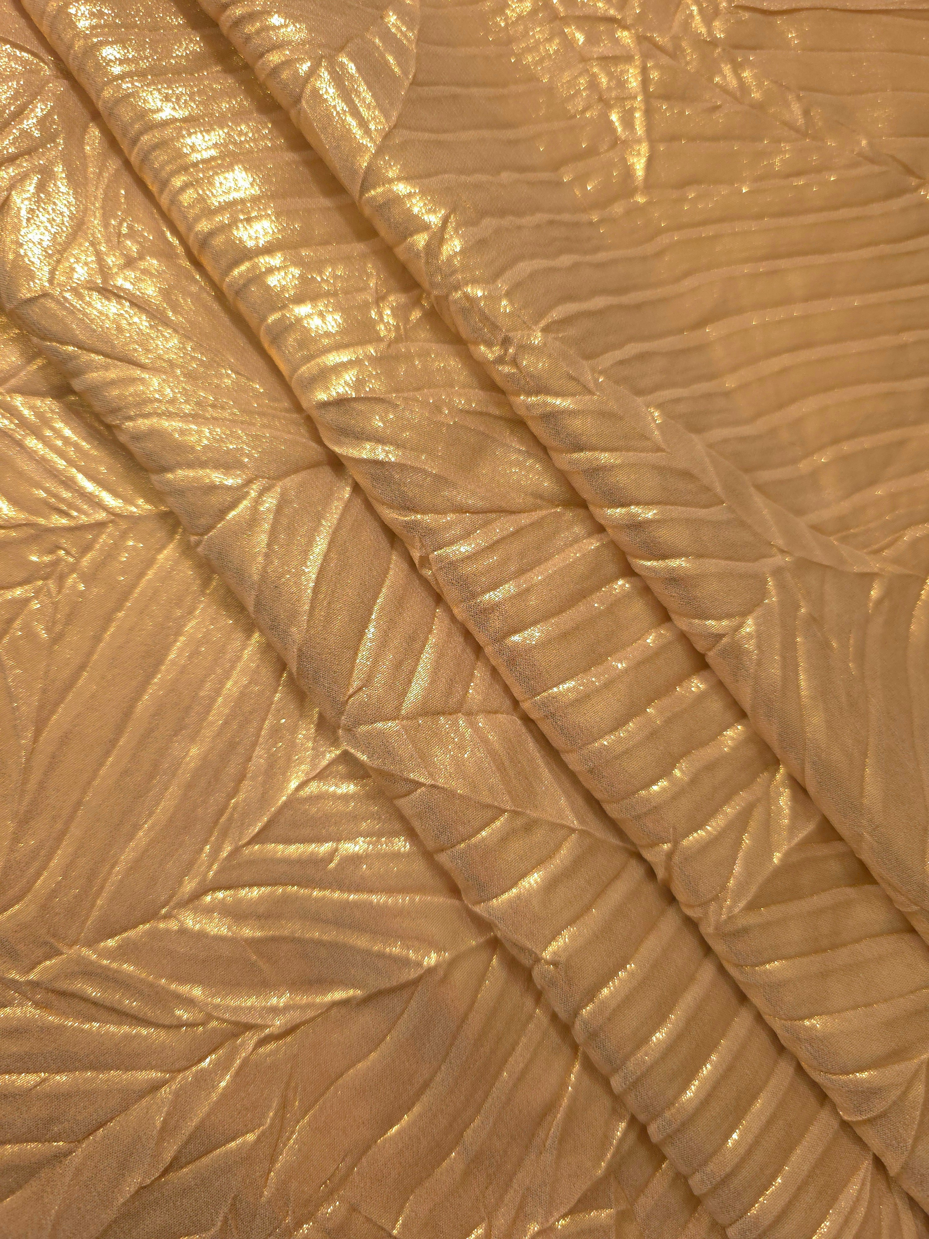 Bronze Gold leaf-pattern plissé fabric in close detail, revealing the fine shimmer and dimensional pleat structure suited to bodice accents and fashion-forward blouses.