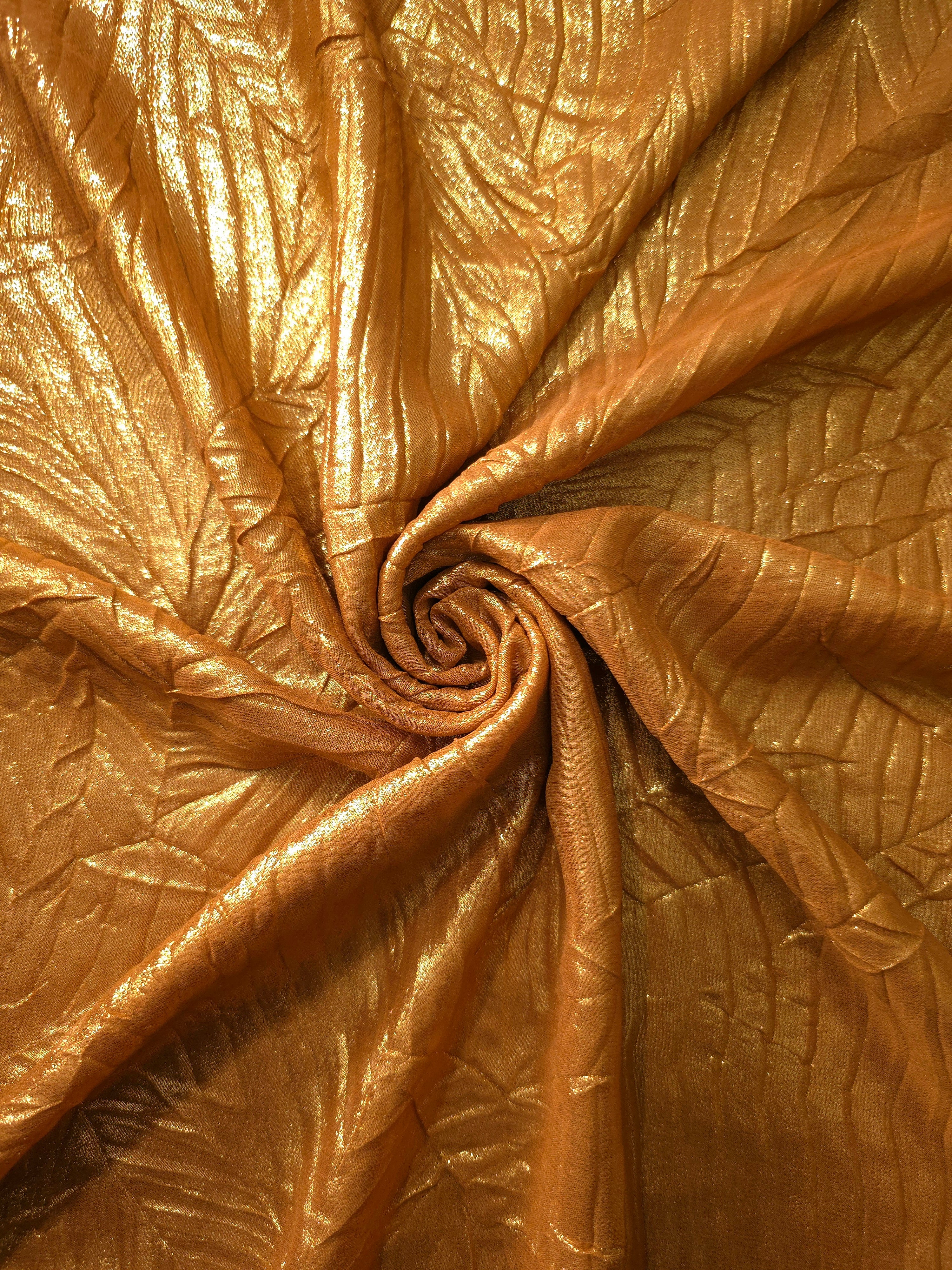 Burnished Copper shimmer plissé shown in a broad view, making the pleat pattern and visual rhythm clear for blouses, skirts and fashion-forward layering pieces.