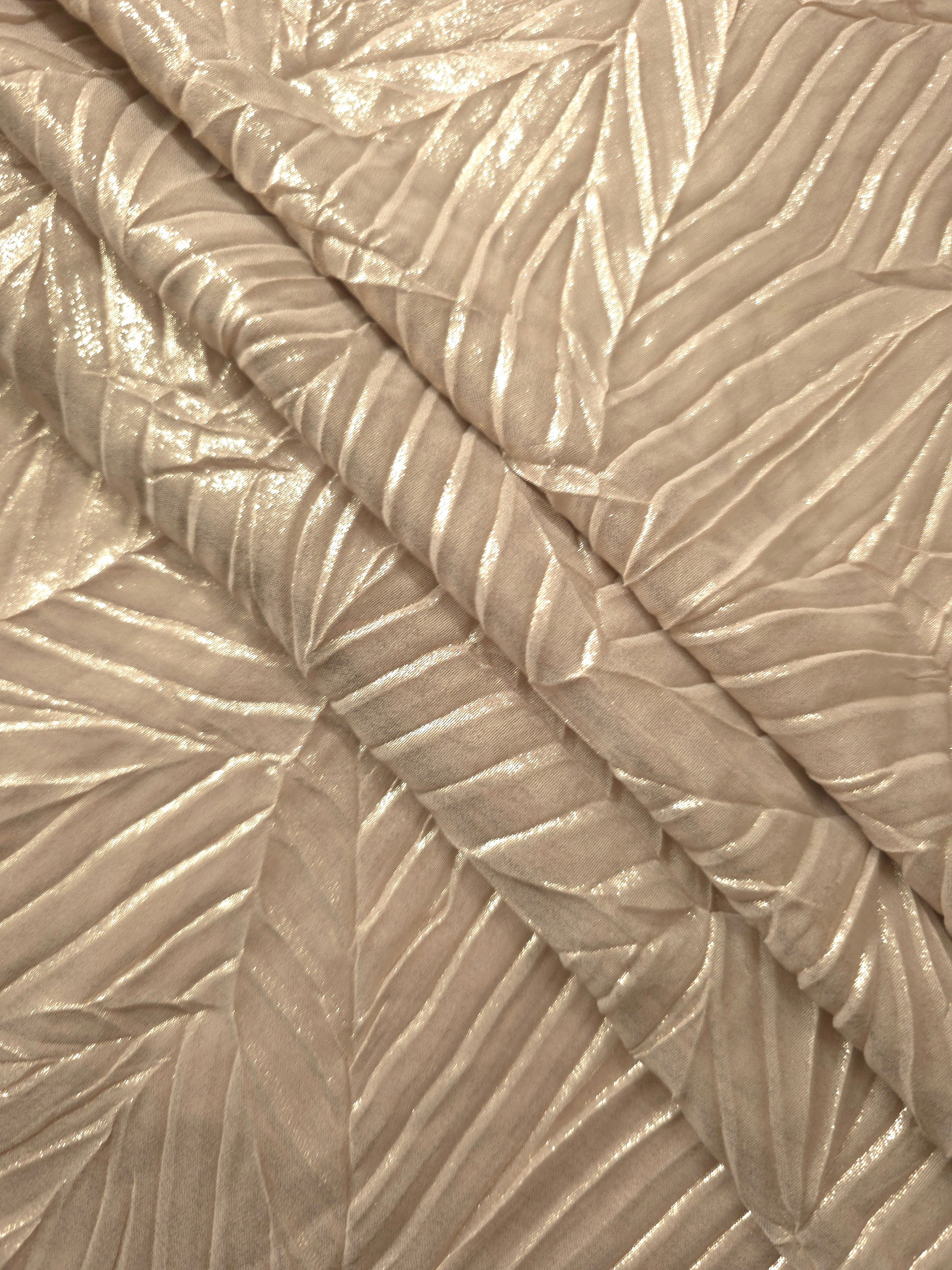 Champagne Cream leaf-pattern plissé fabric in close detail, revealing the fine shimmer and dimensional pleat structure suited to bodice accents and fashion-forward blouses.
