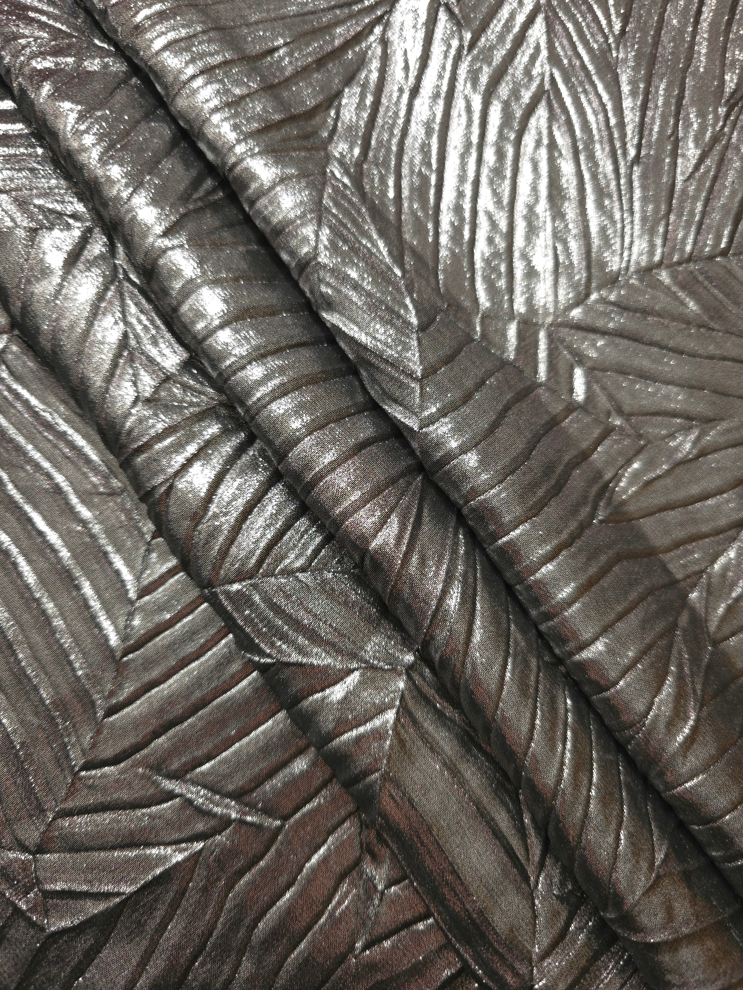 Graphite Gray leaf-pattern plissé fabric in close detail, revealing the fine shimmer and dimensional pleat structure suited to bodice accents and fashion-forward blouses.