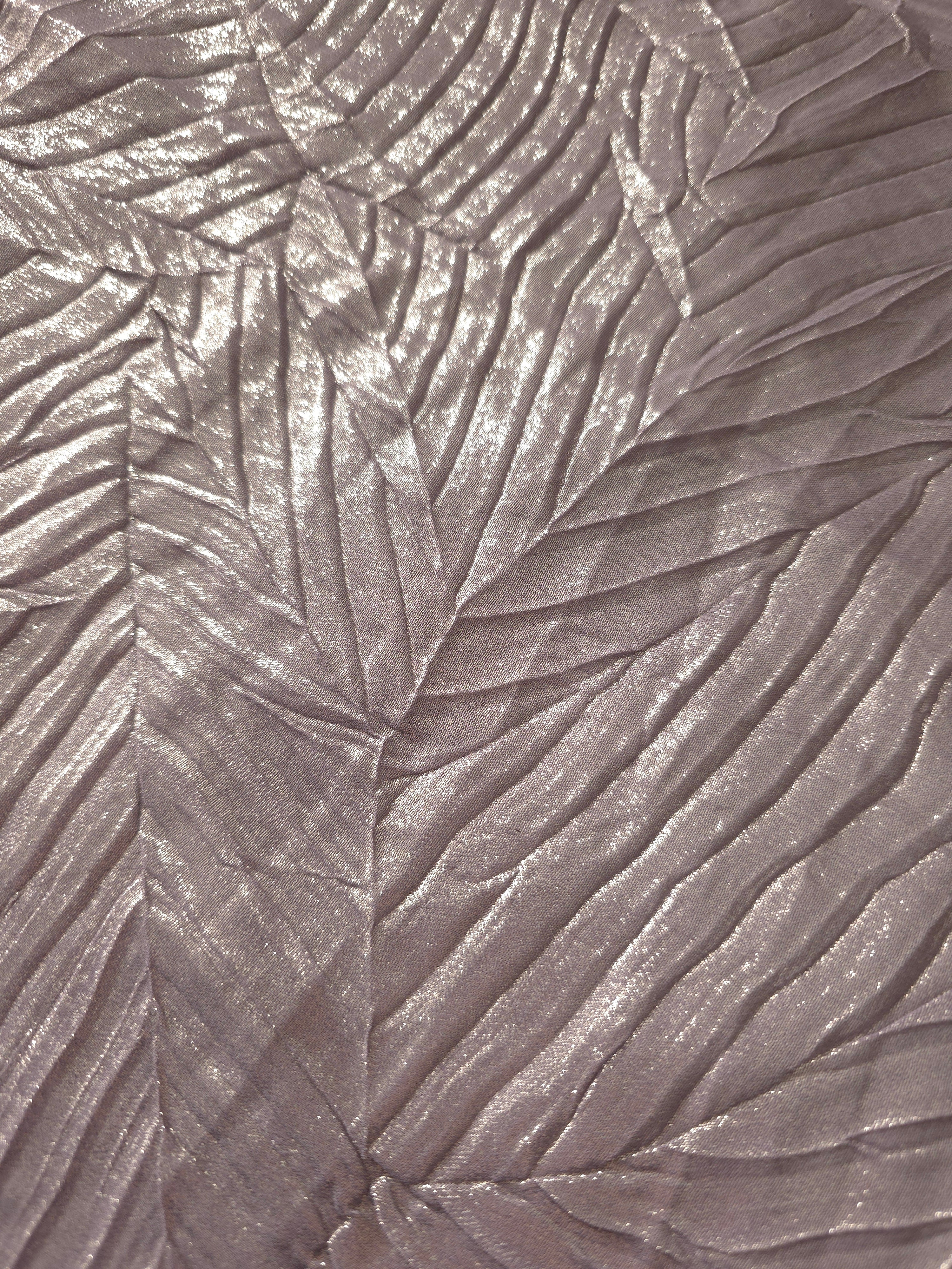 Soft drape of Lavender Taupe textured shimmer plissé reveals dimensional folds and shifting reflection for formal tops and draped skirt designs.